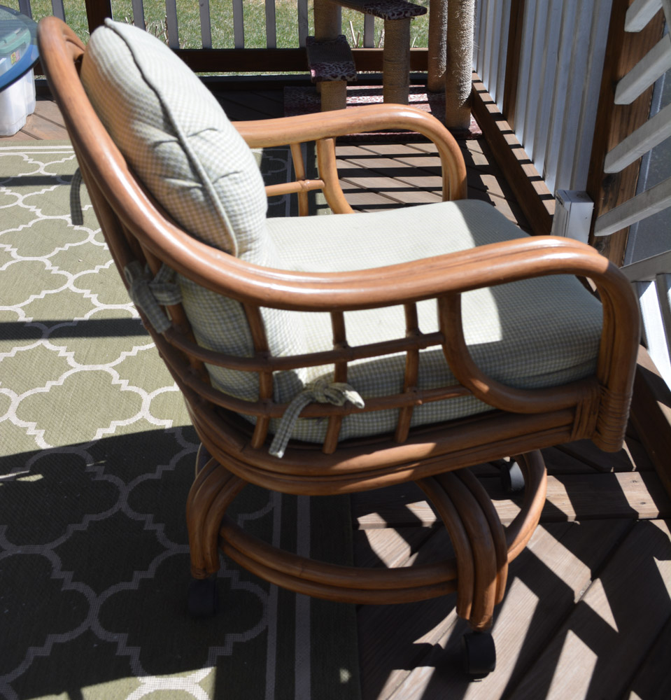 Glass-Top Pedestal Table with Rattan Chairs