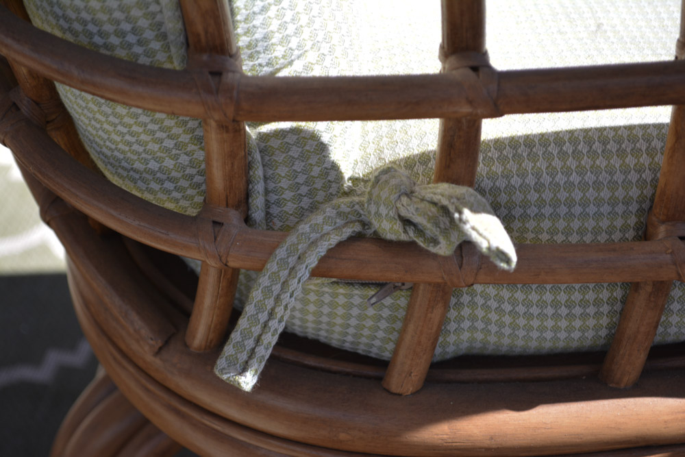 Glass-Top Pedestal Table with Rattan Chairs