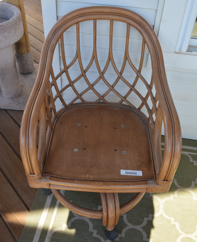 Glass-Top Pedestal Table with Rattan Chairs