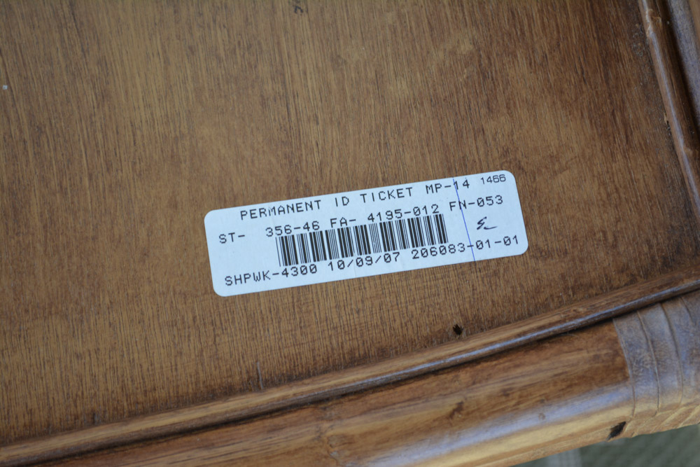 Glass-Top Pedestal Table with Rattan Chairs