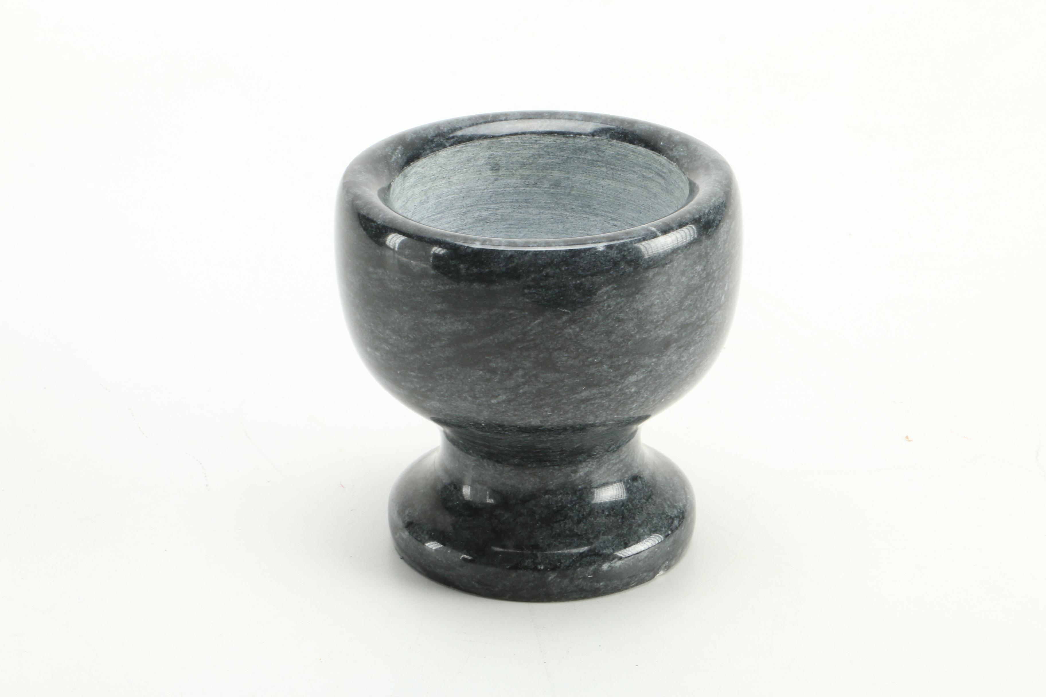 Black Fossiliferous Limestone Plate with a Mortar and Pestle