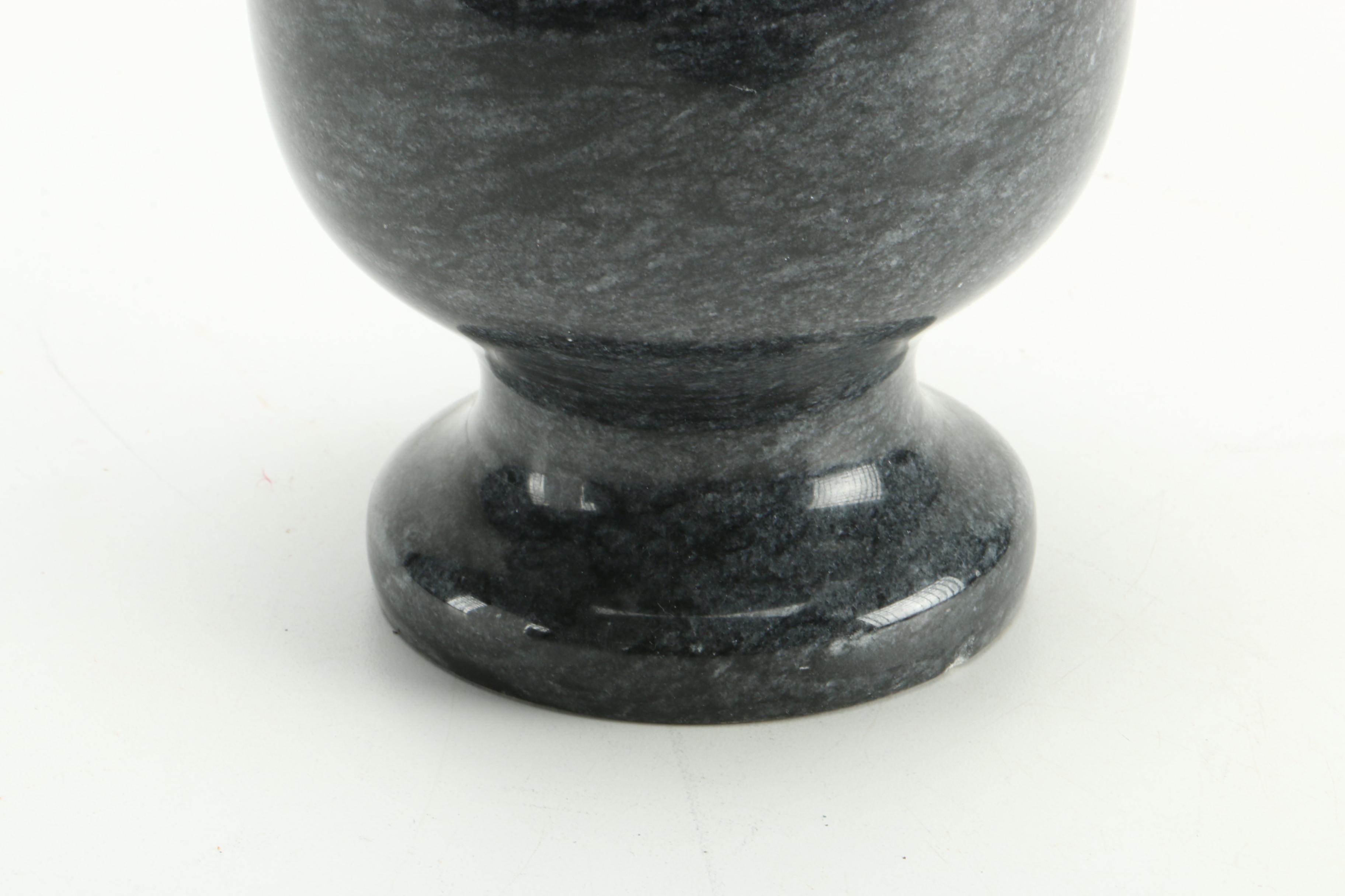 Black Fossiliferous Limestone Plate with a Mortar and Pestle