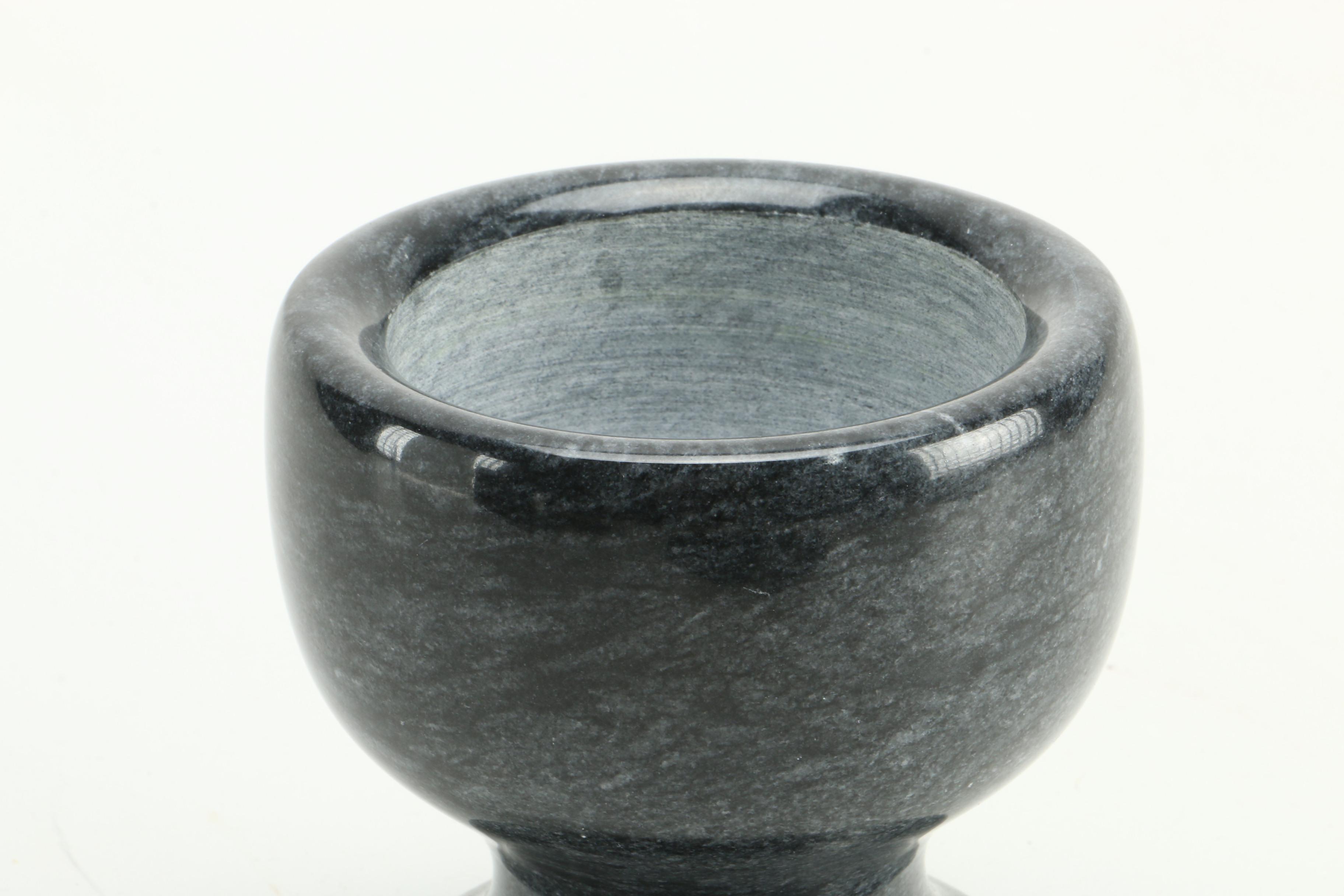 Black Fossiliferous Limestone Plate with a Mortar and Pestle