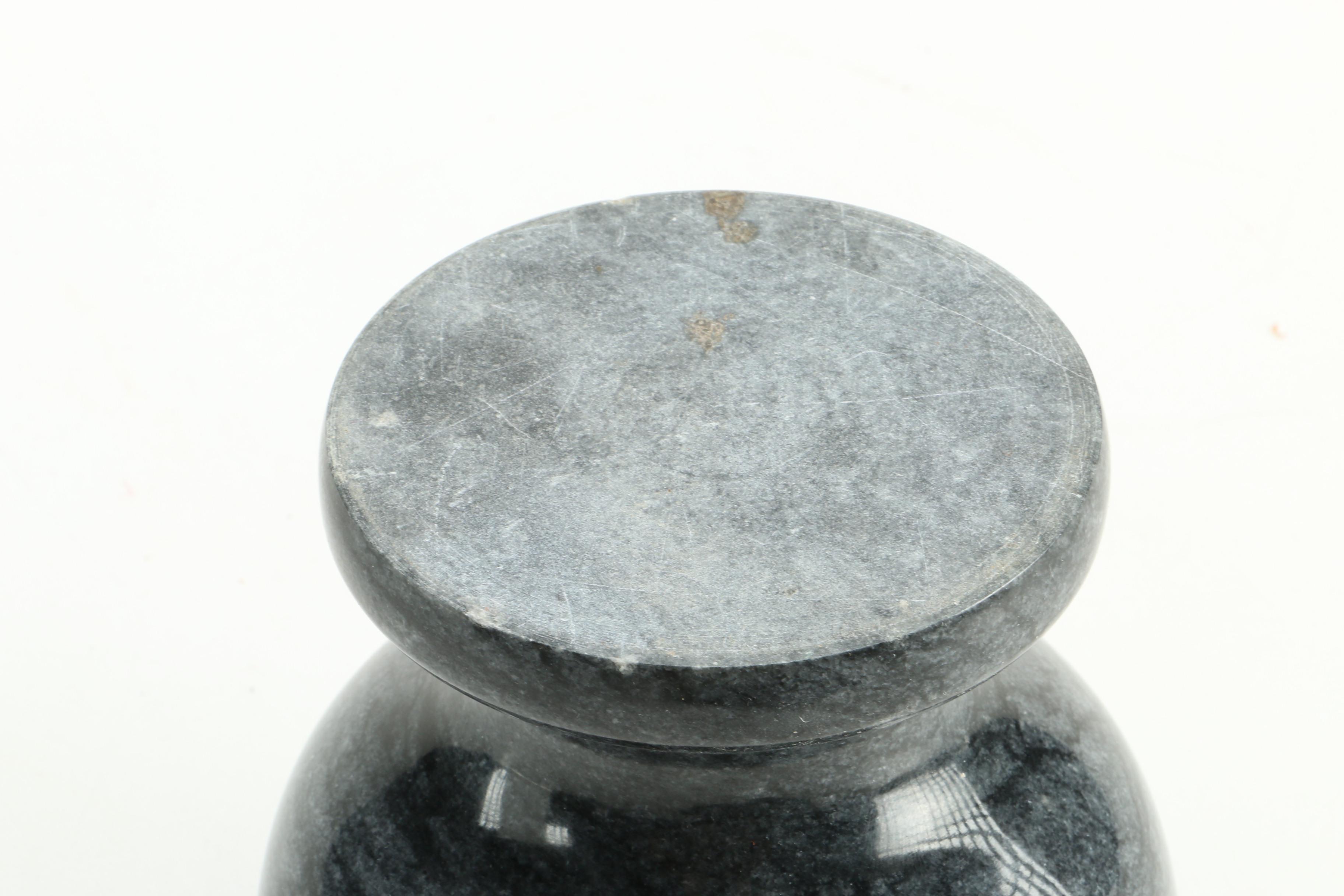 Black Fossiliferous Limestone Plate with a Mortar and Pestle