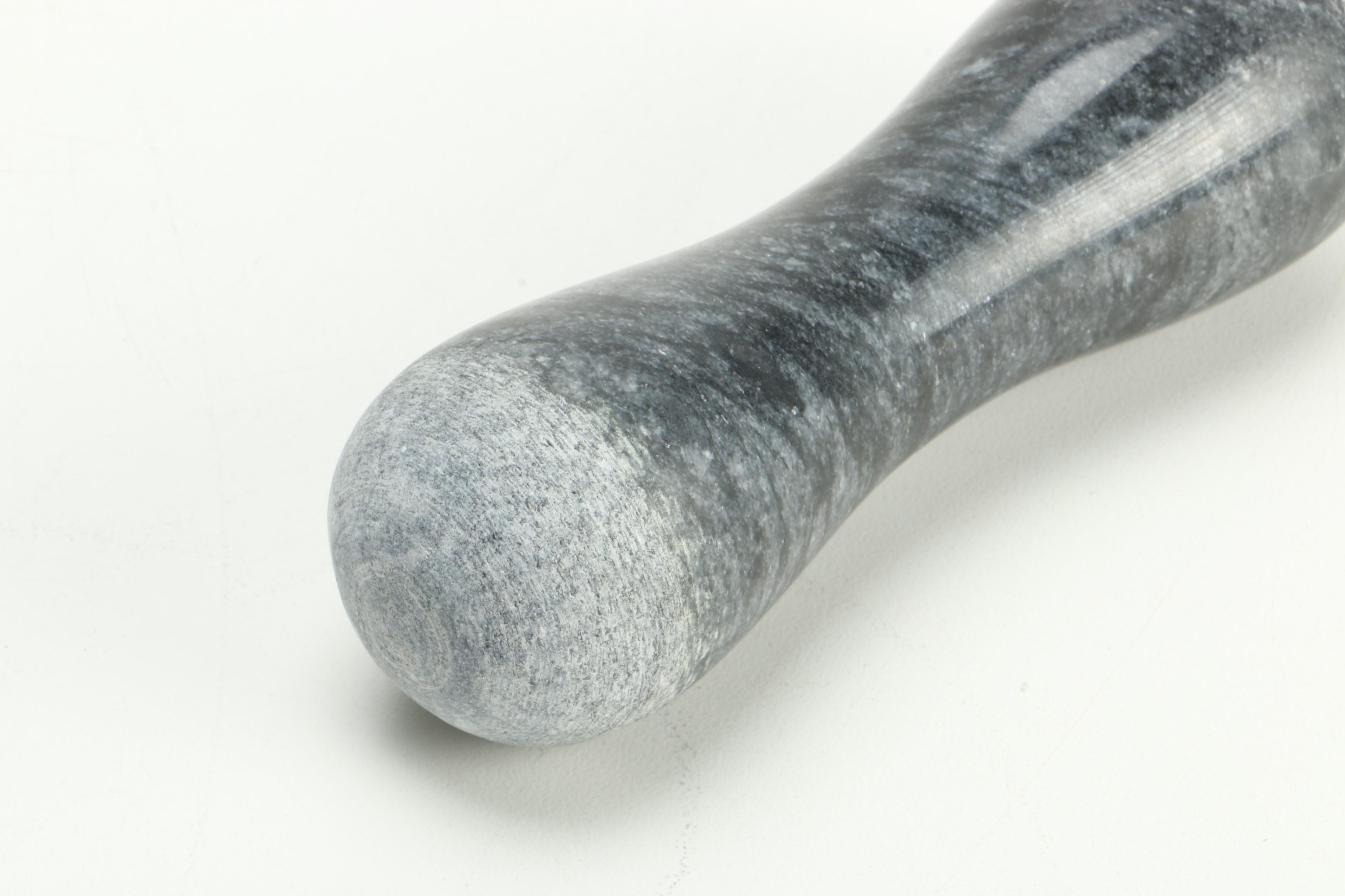 Black Fossiliferous Limestone Plate with a Mortar and Pestle