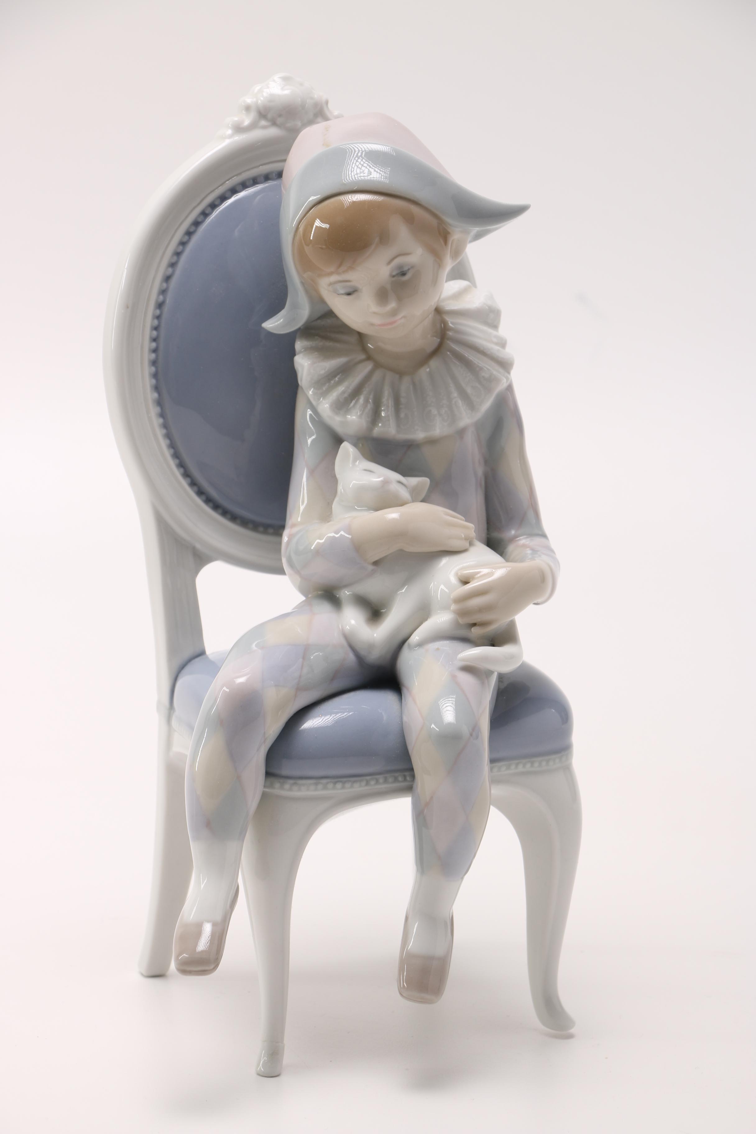 Lladró Young Harlequin Boy in a Chair with a Cat Figurine