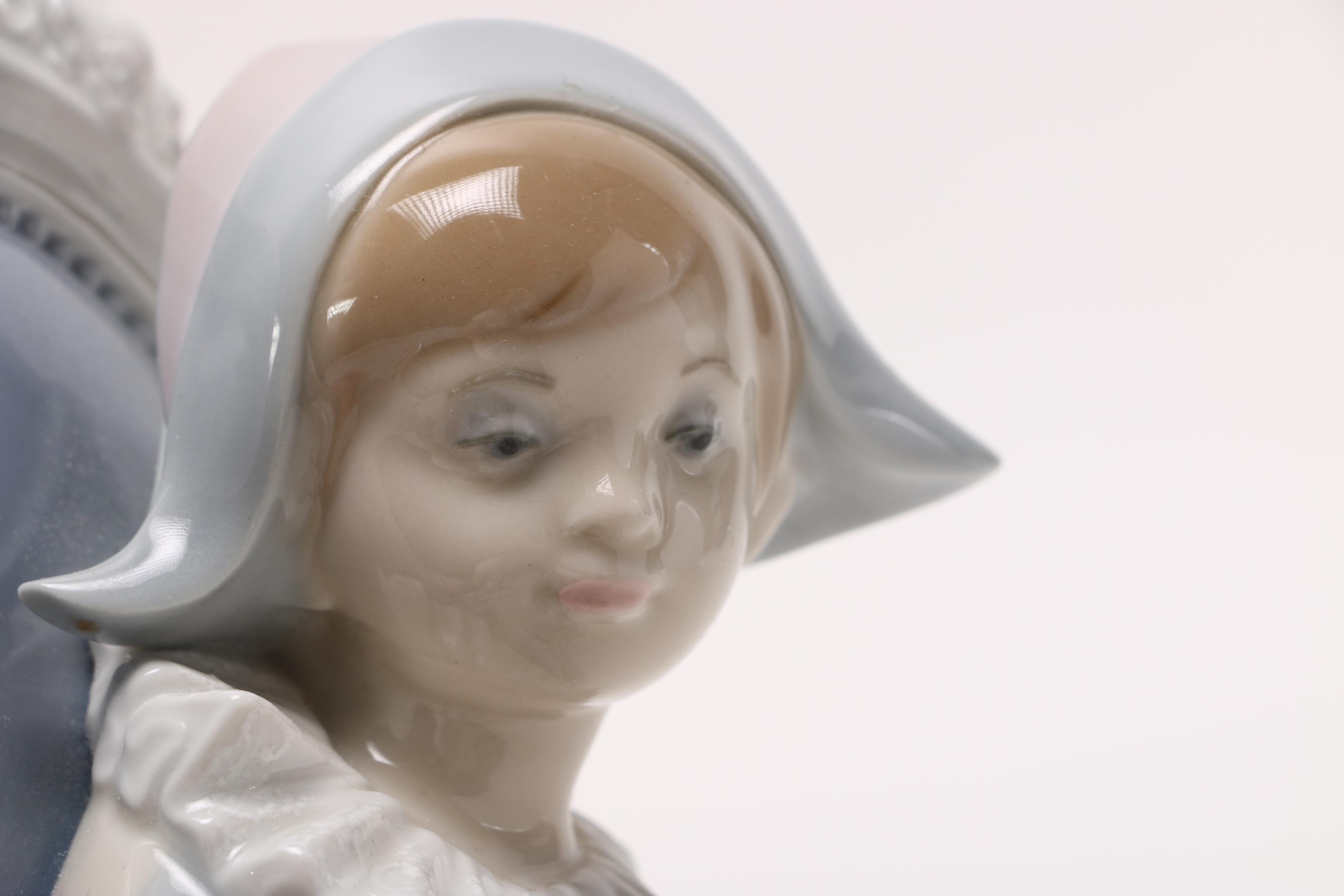 Lladró Young Harlequin Boy in a Chair with a Cat Figurine