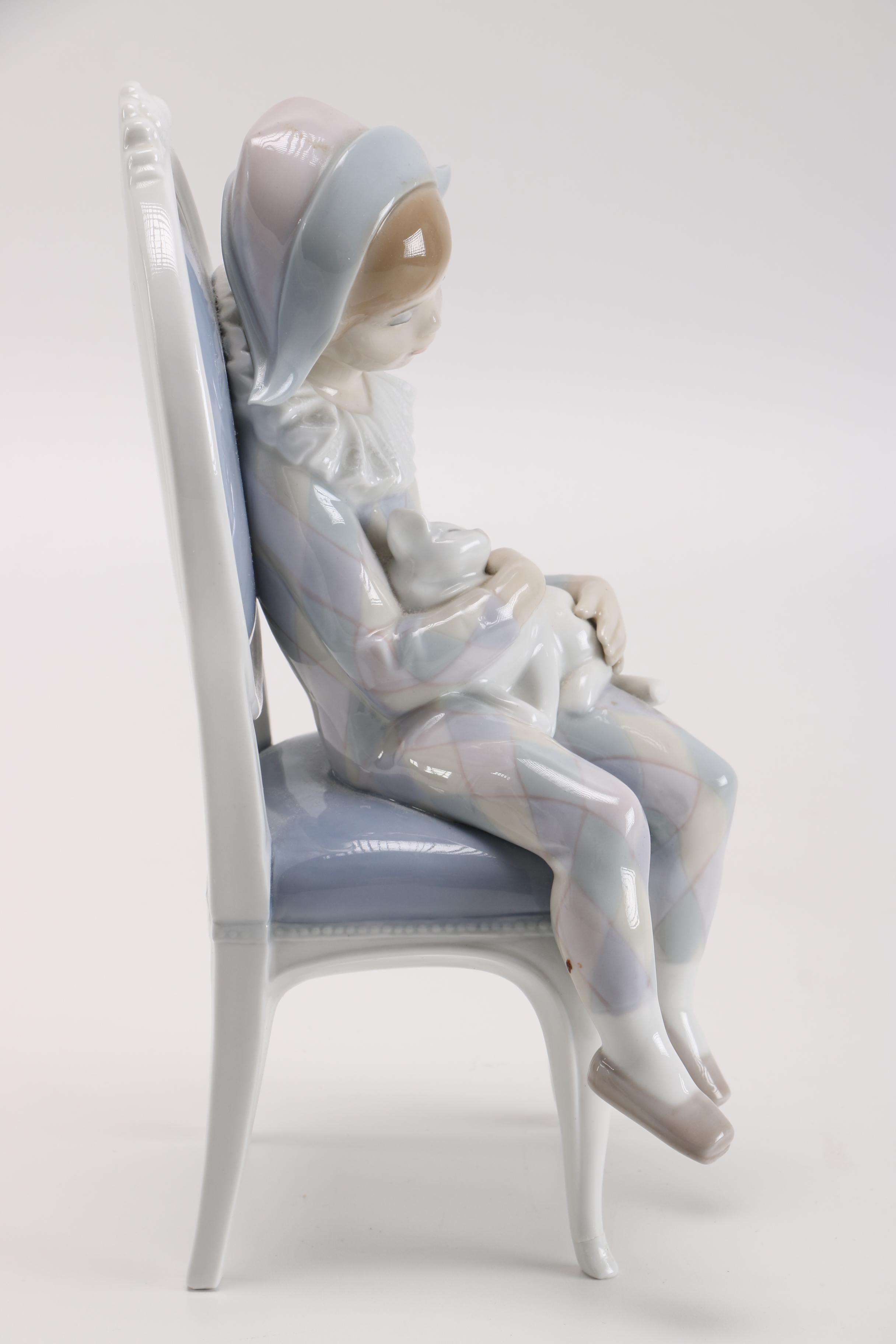 Lladró Young Harlequin Boy in a Chair with a Cat Figurine
