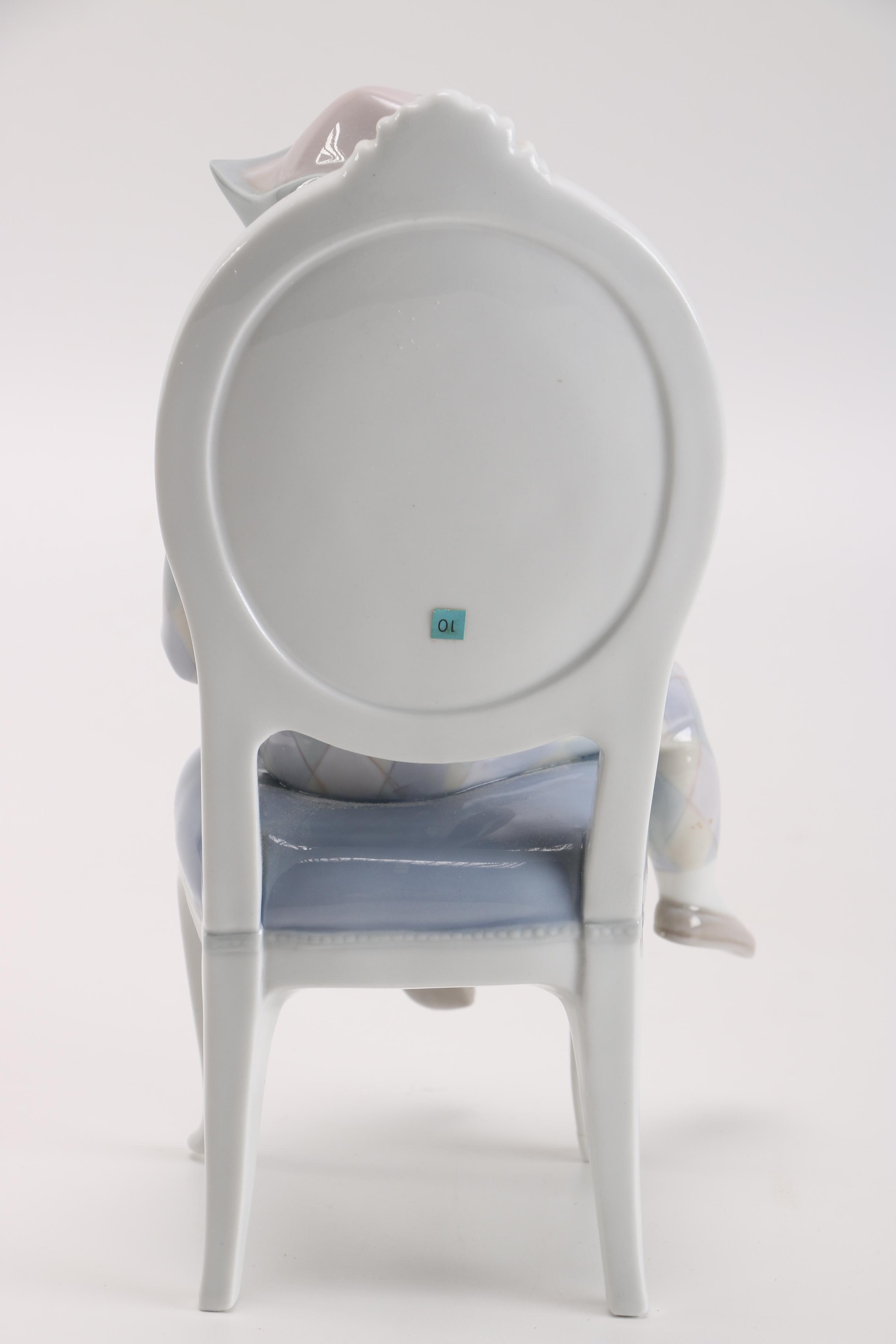 Lladró Young Harlequin Boy in a Chair with a Cat Figurine