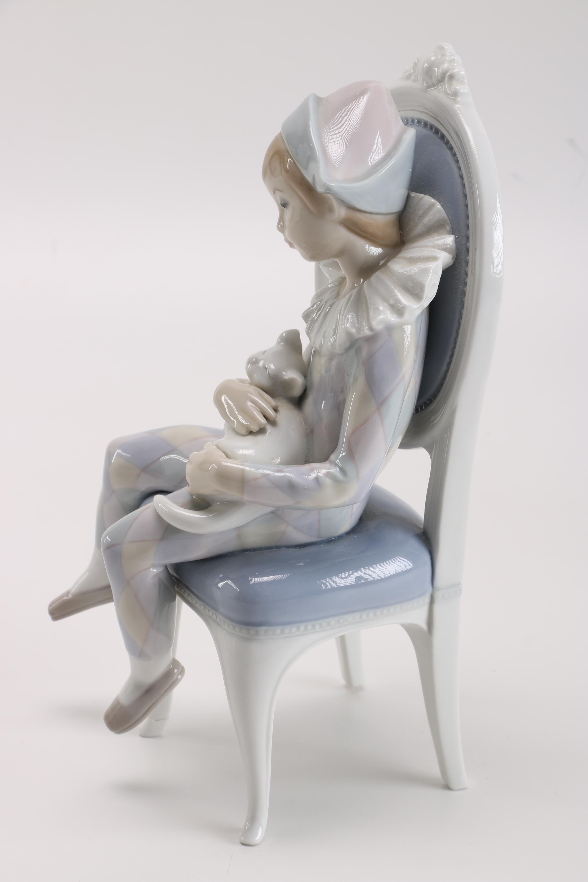 Lladró Young Harlequin Boy in a Chair with a Cat Figurine