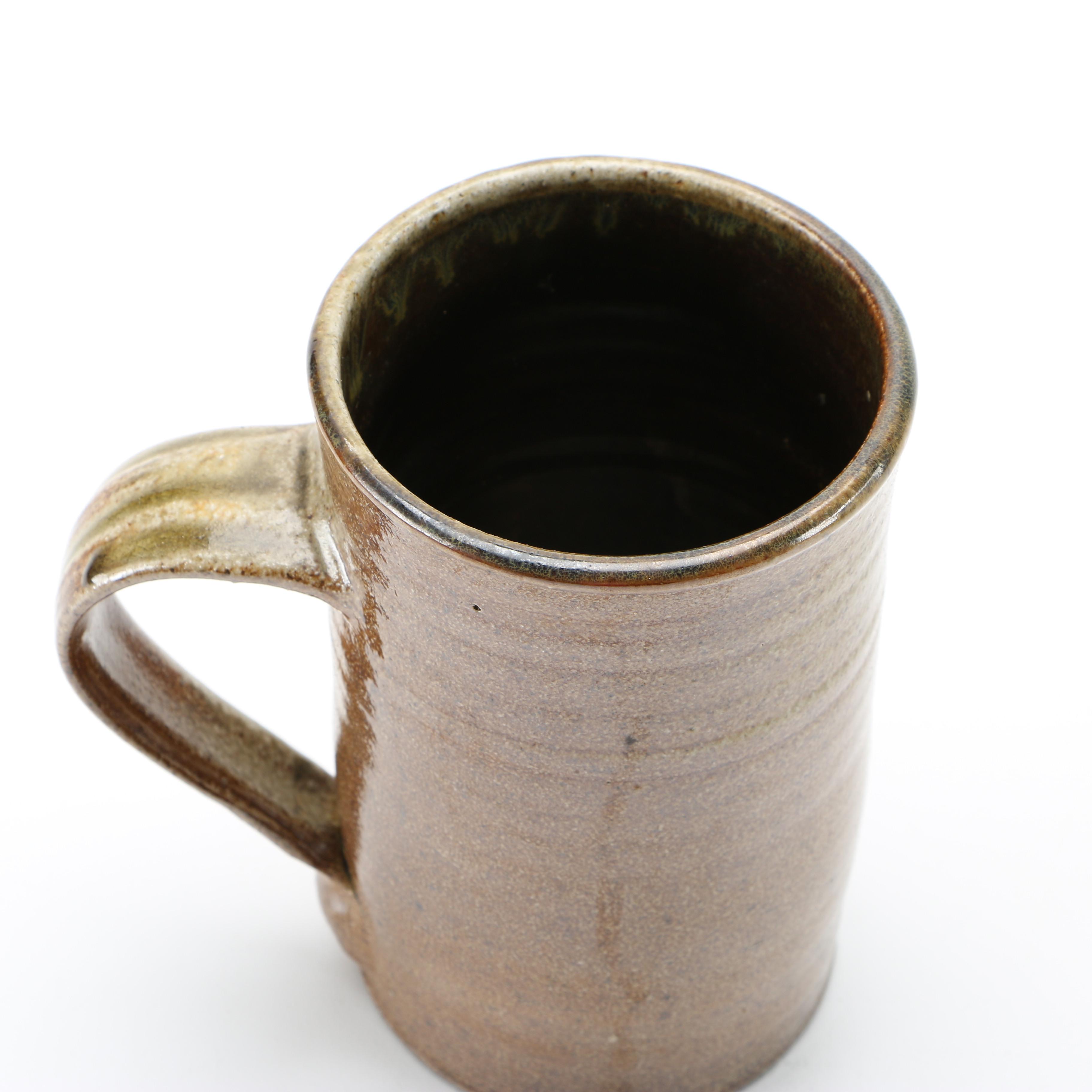 Decorative Earthenware Vessels and Figural Candle Holder