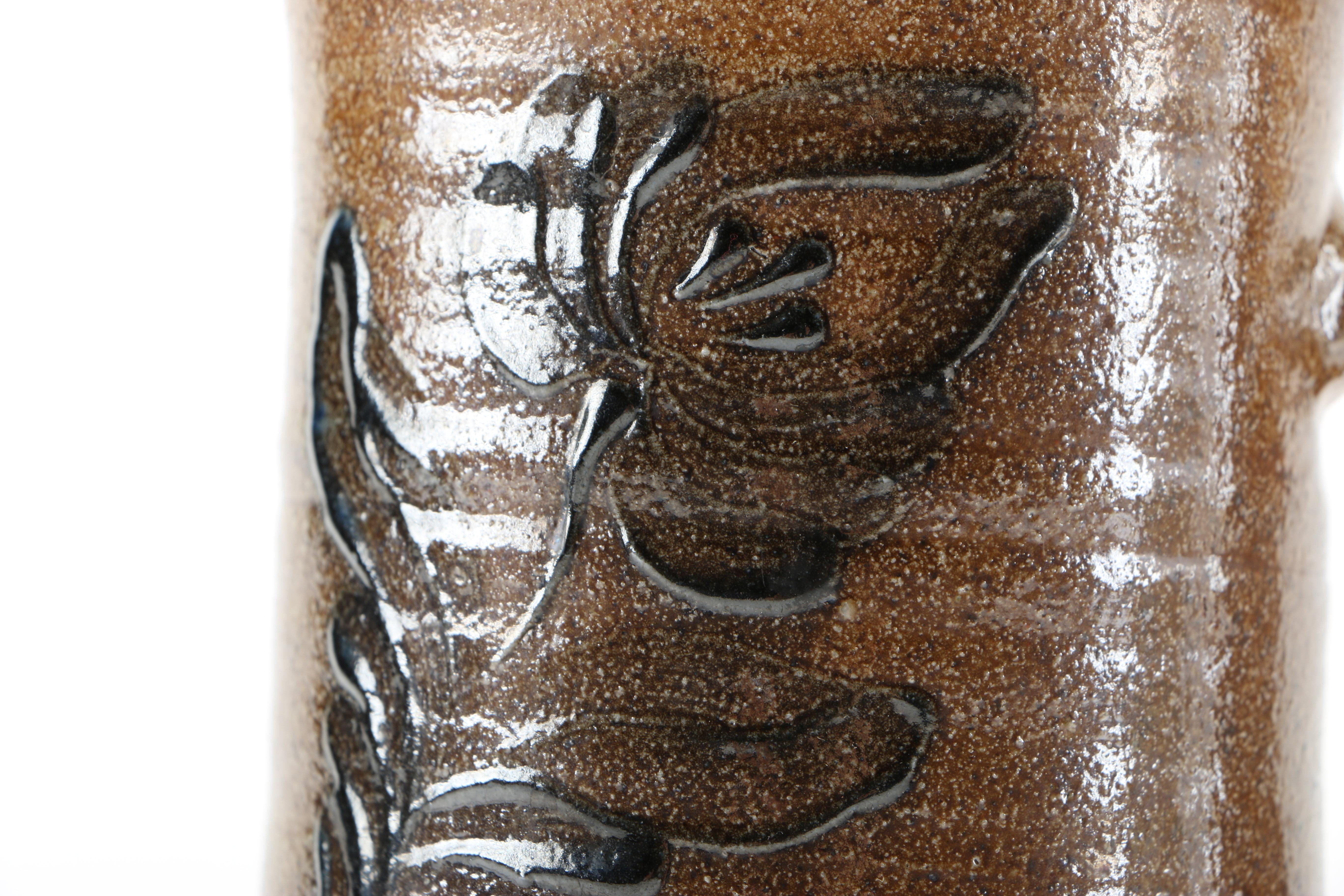 Decorative Earthenware Vessels and Figural Candle Holder