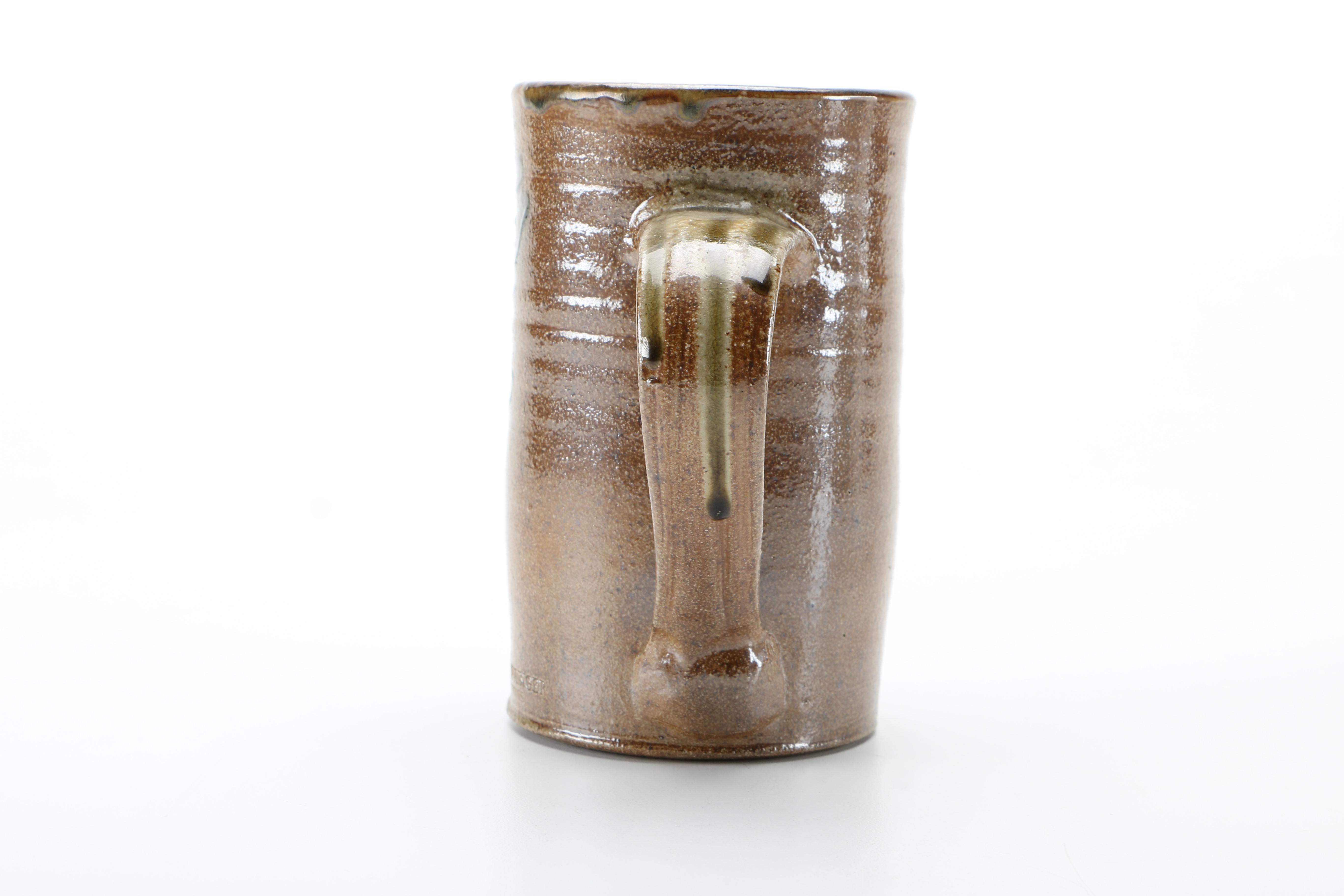 Decorative Earthenware Vessels and Figural Candle Holder