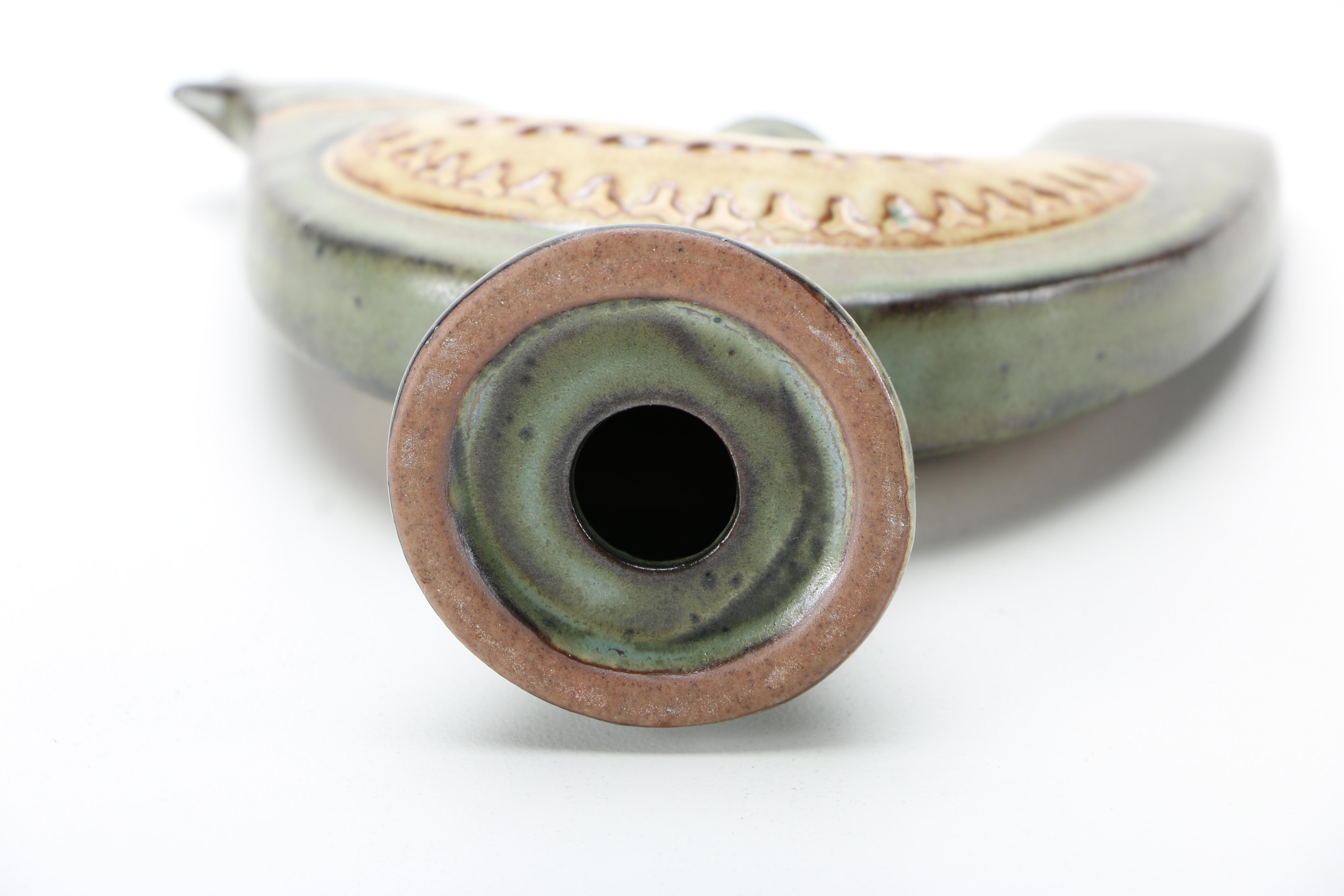 Decorative Earthenware Vessels and Figural Candle Holder