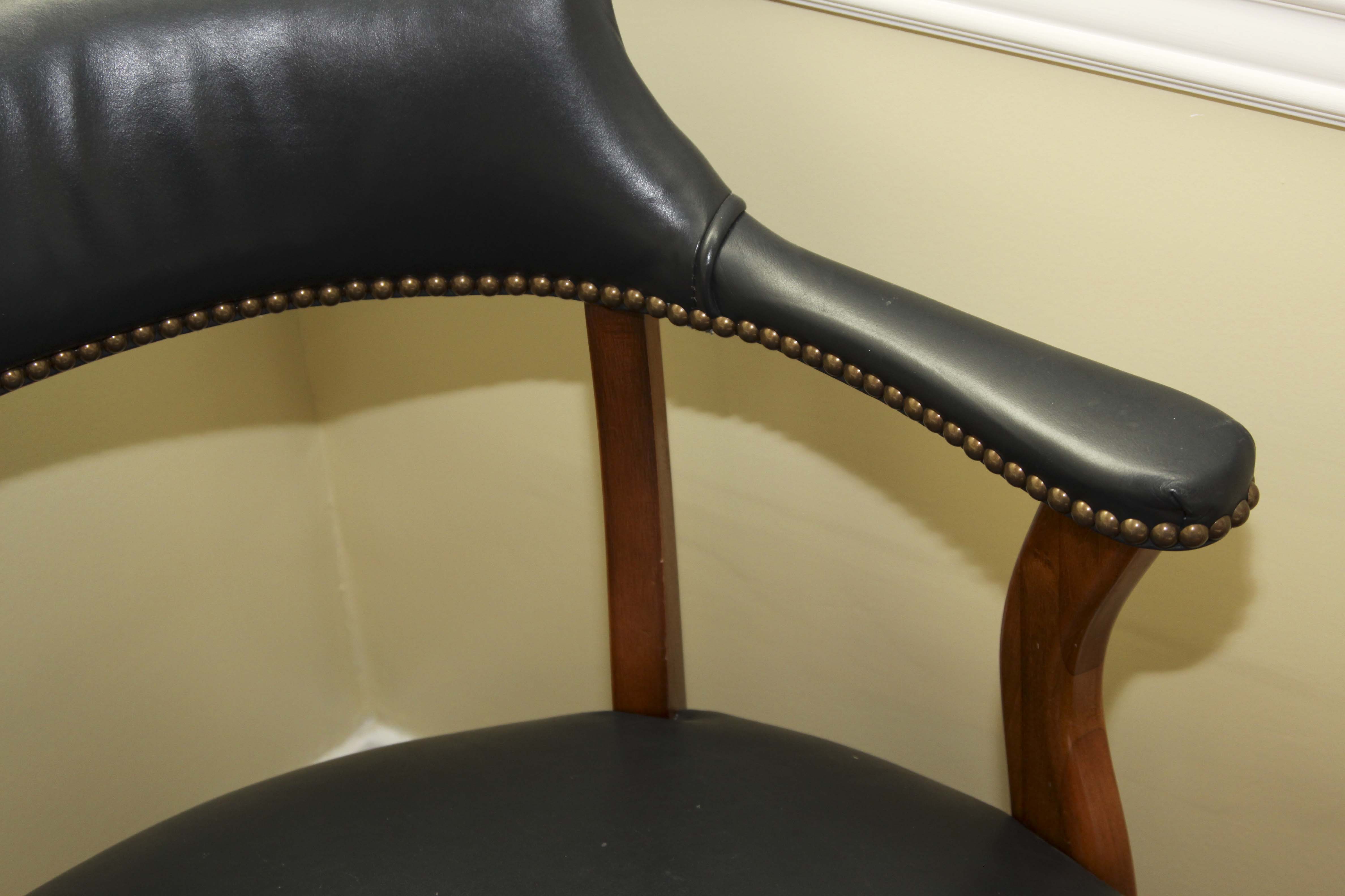 A Pair of Leather Captains Chairs