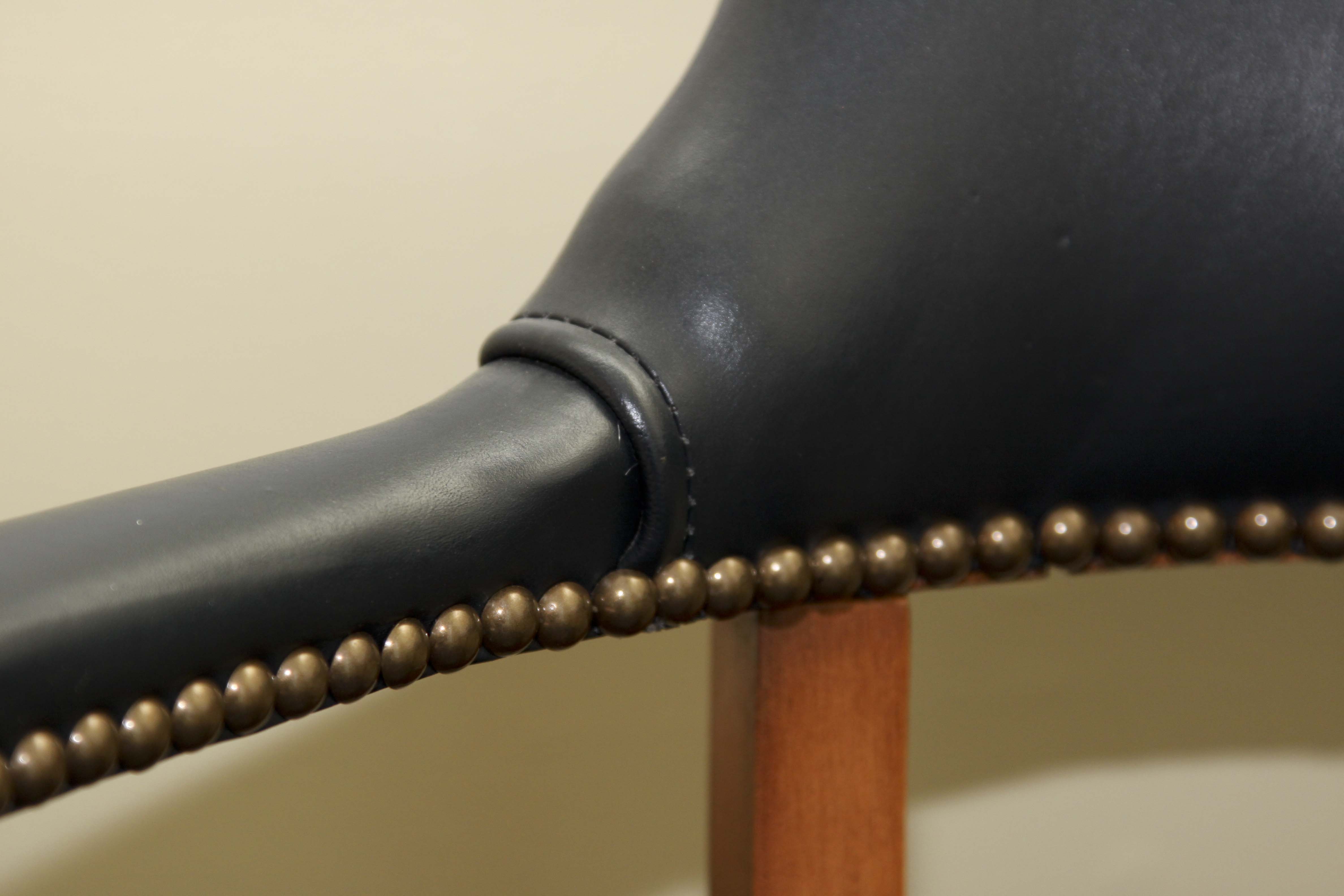 A Pair of Leather Captains Chairs