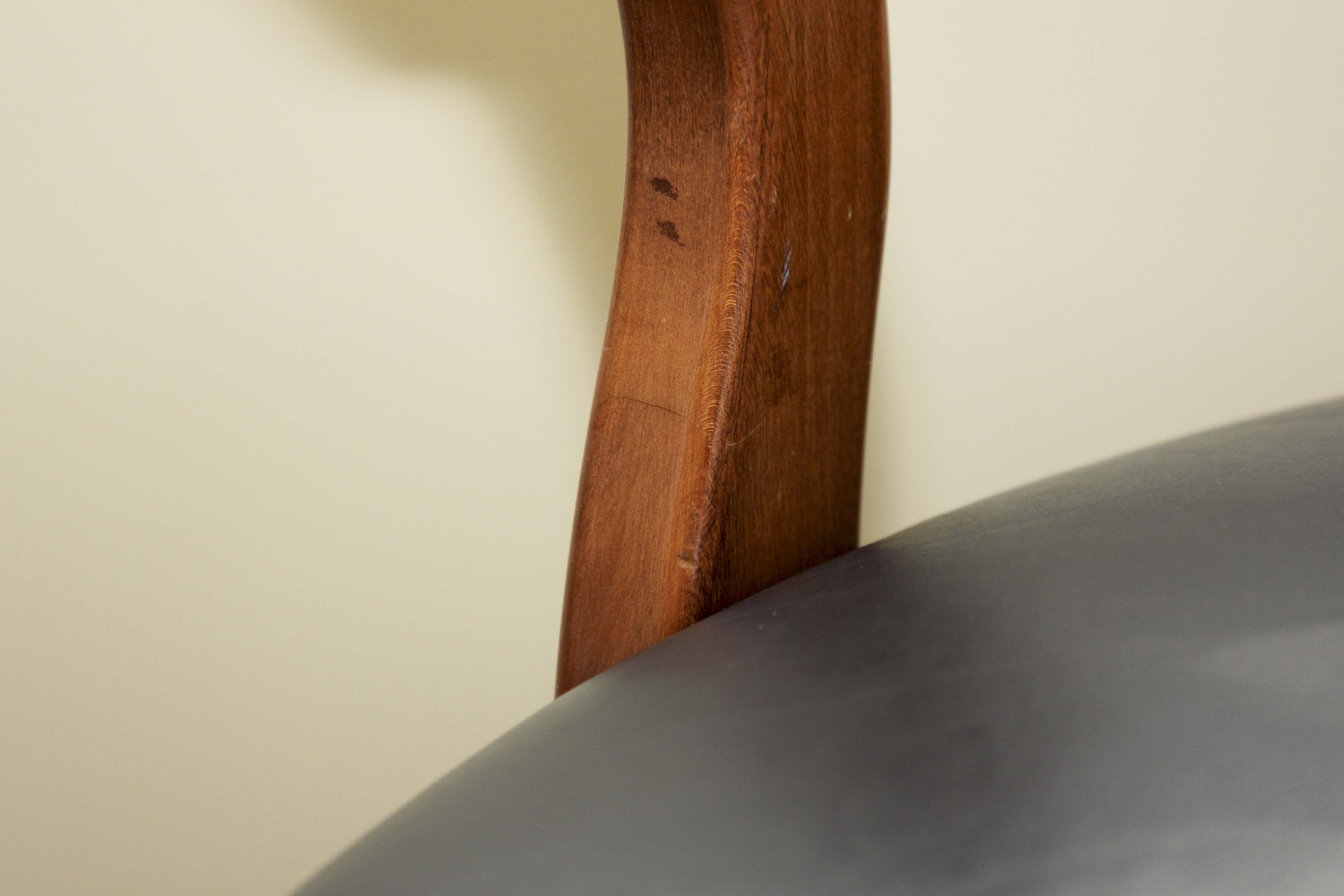 A Pair of Leather Captains Chairs