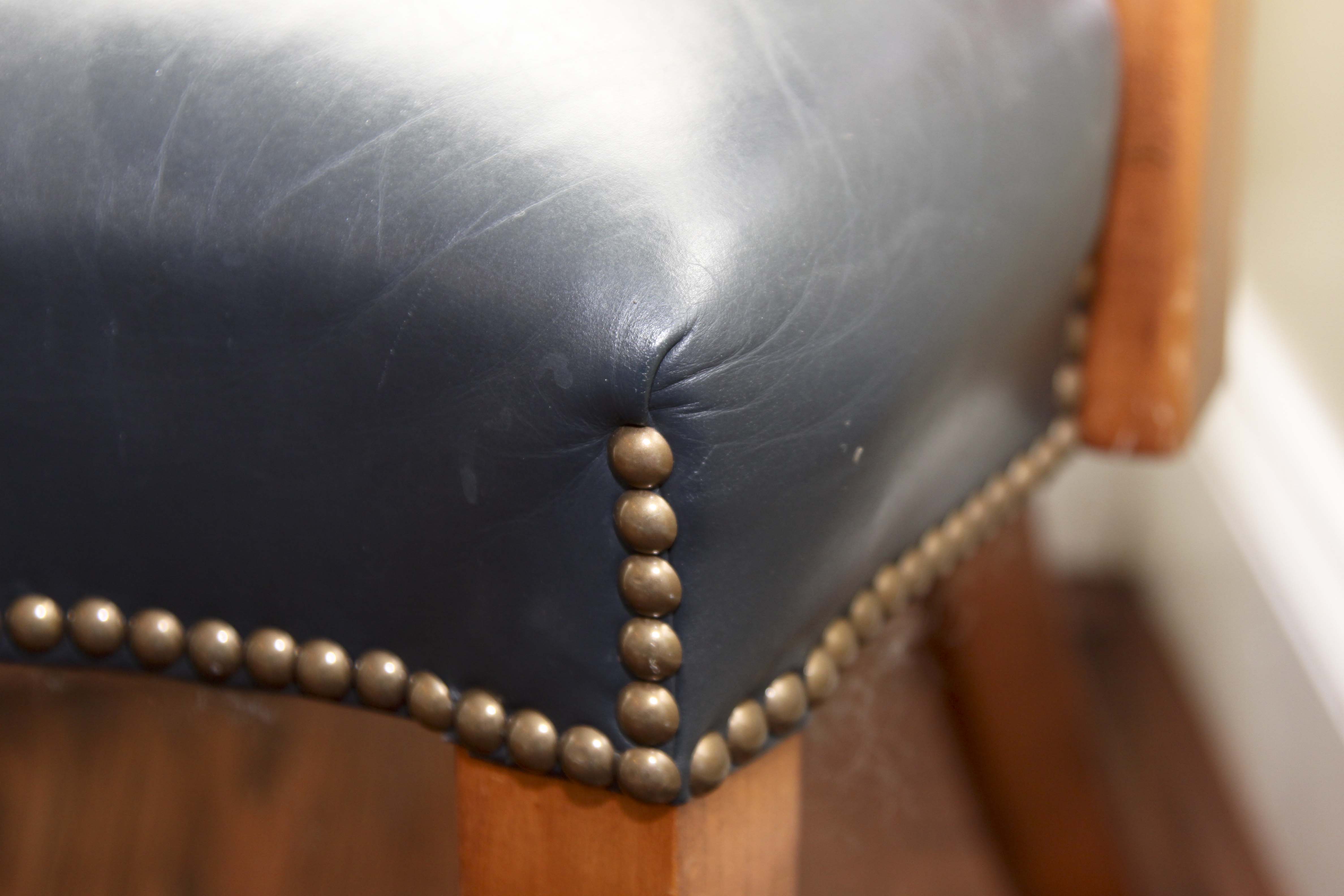 A Pair of Leather Captains Chairs