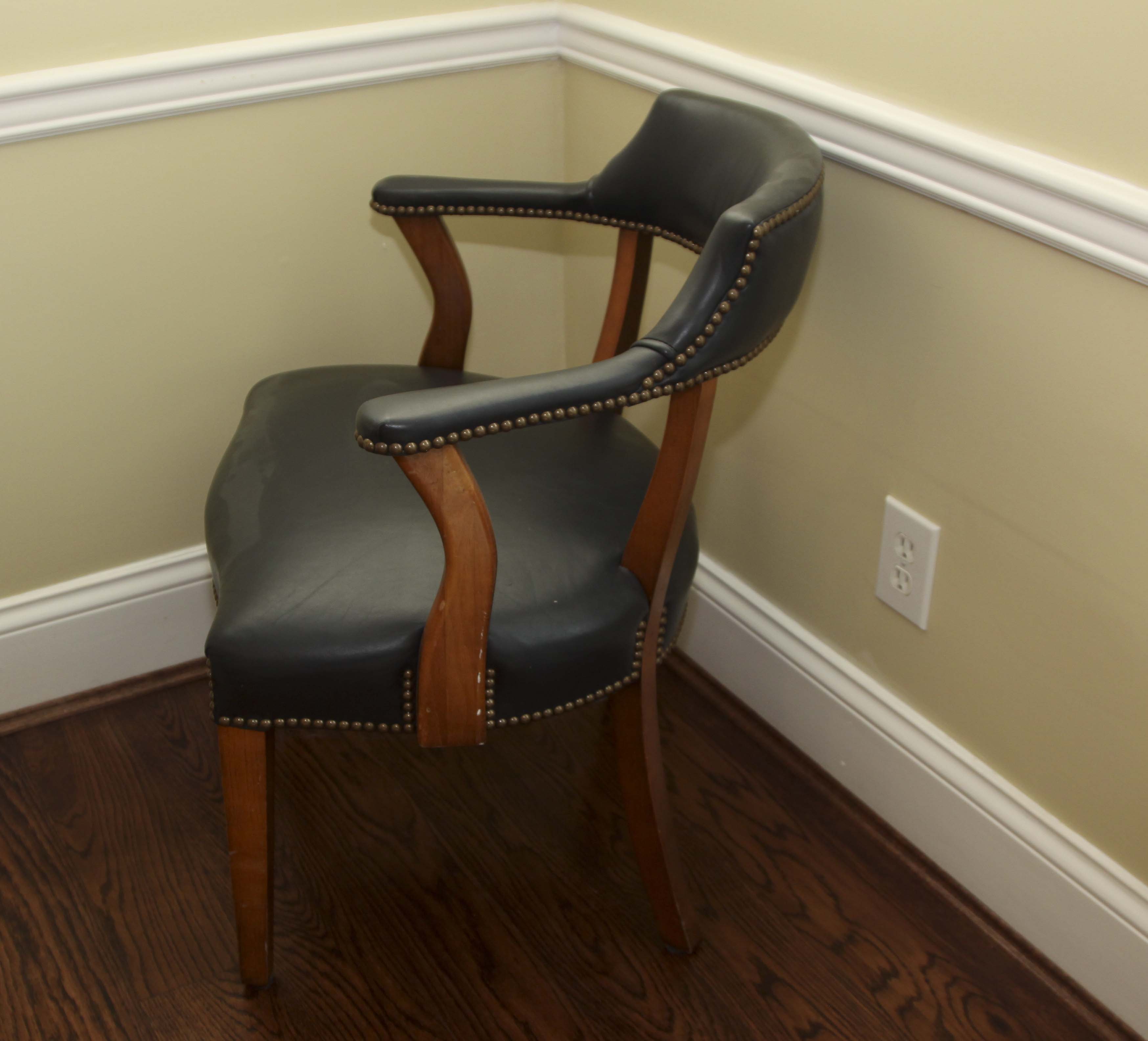 A Pair of Leather Captains Chairs