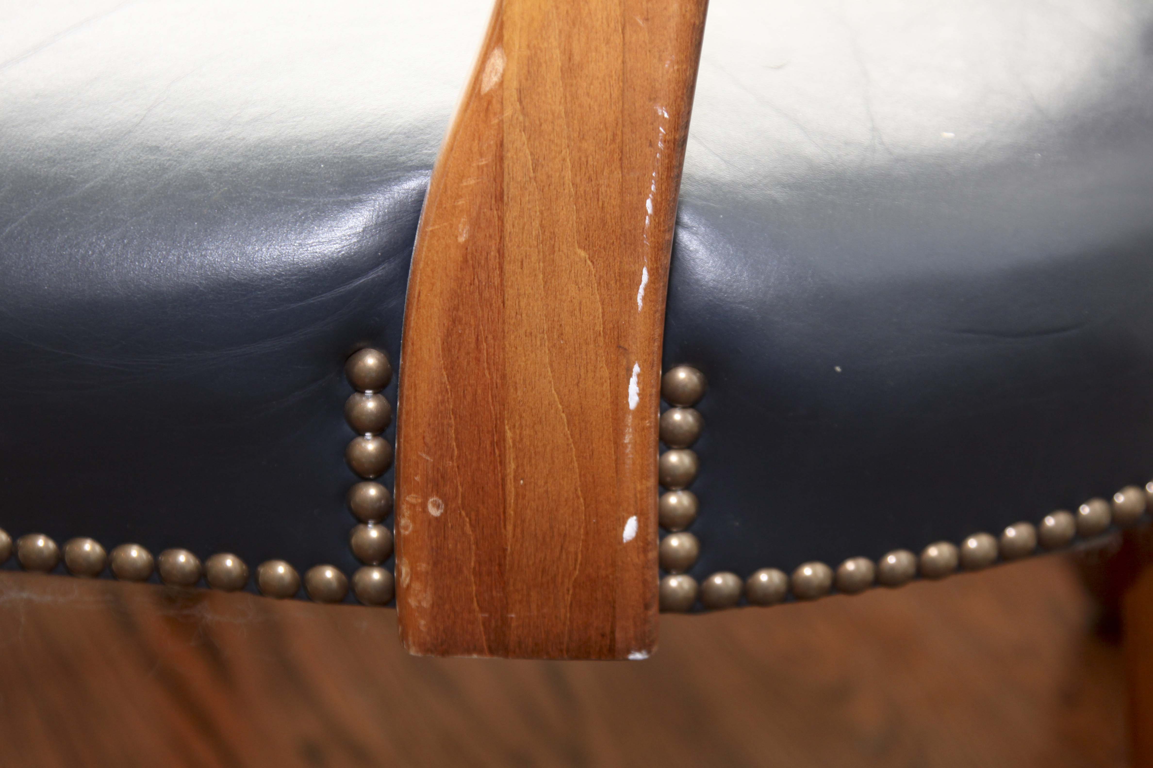 A Pair of Leather Captains Chairs