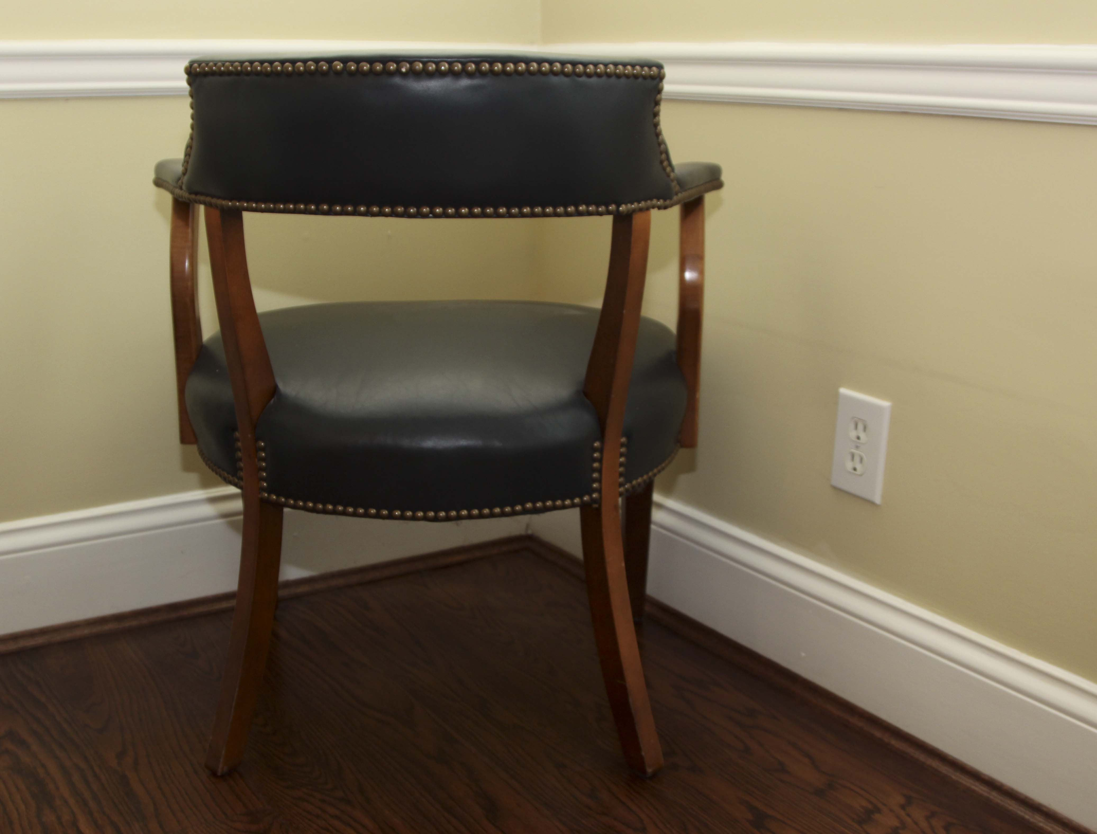 A Pair of Leather Captains Chairs