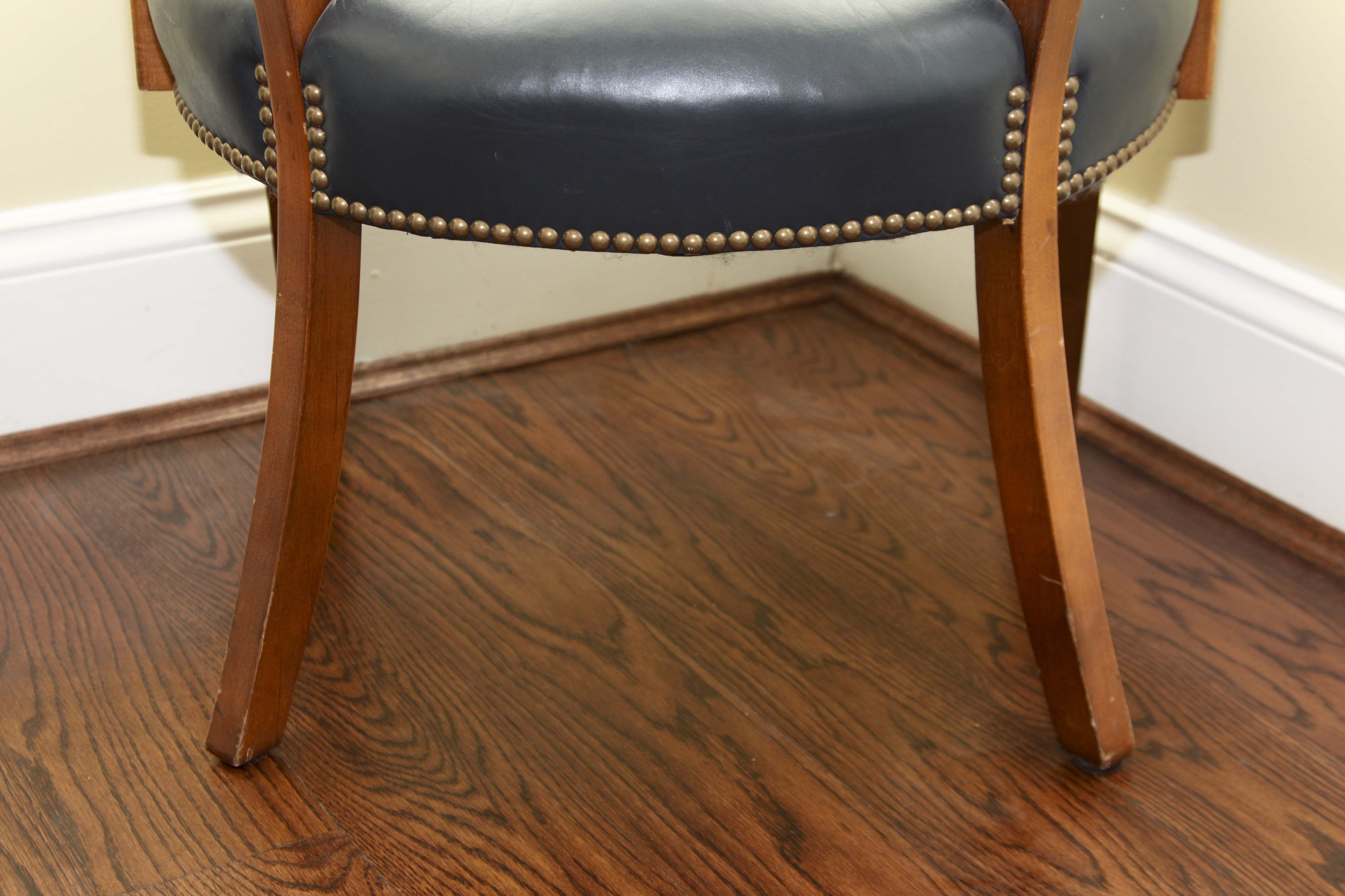 A Pair of Leather Captains Chairs