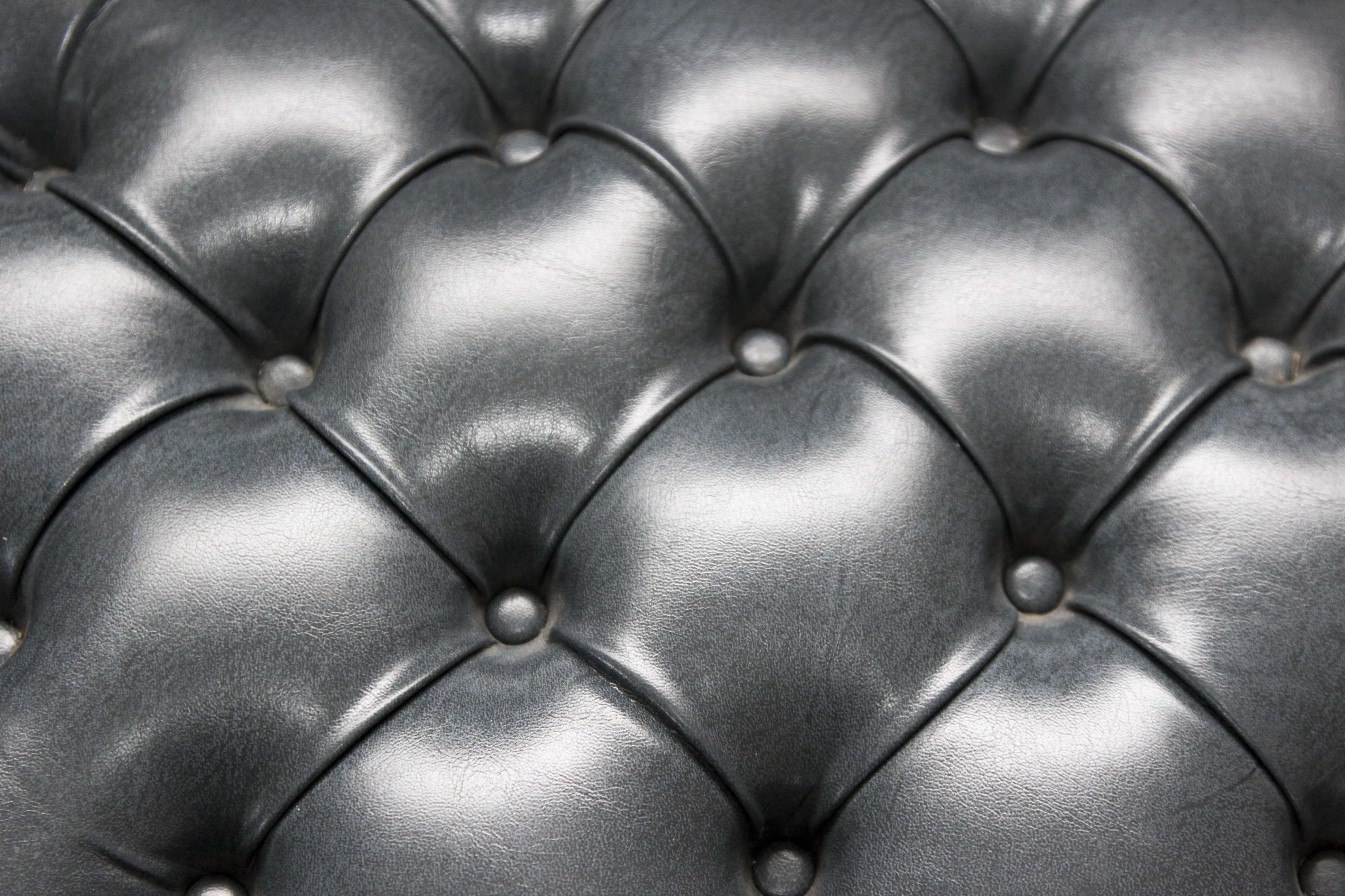 A Pair of Steel Blue Upholstered Tufted Armchairs