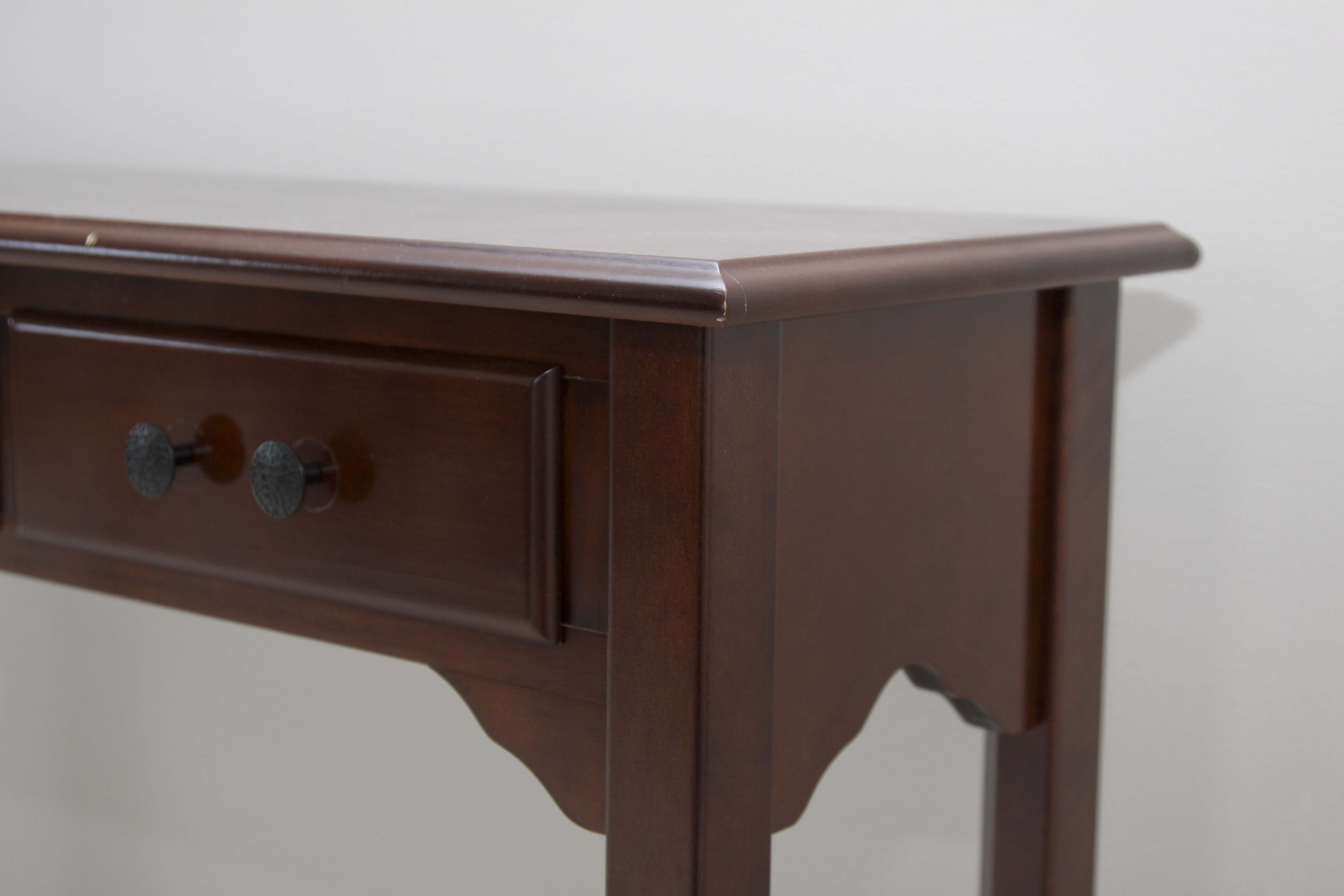 A Three Drawer Console Table