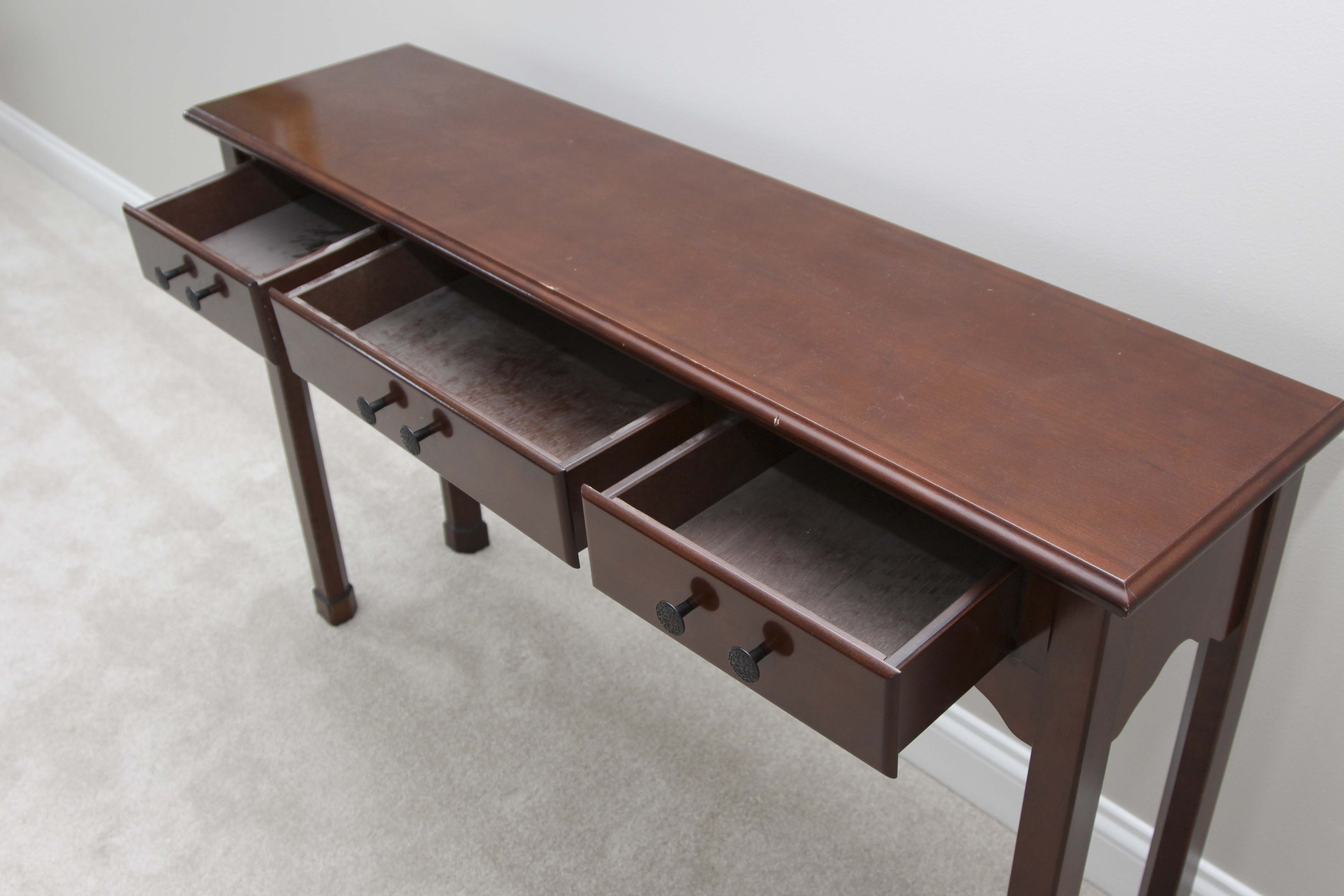 A Three Drawer Console Table