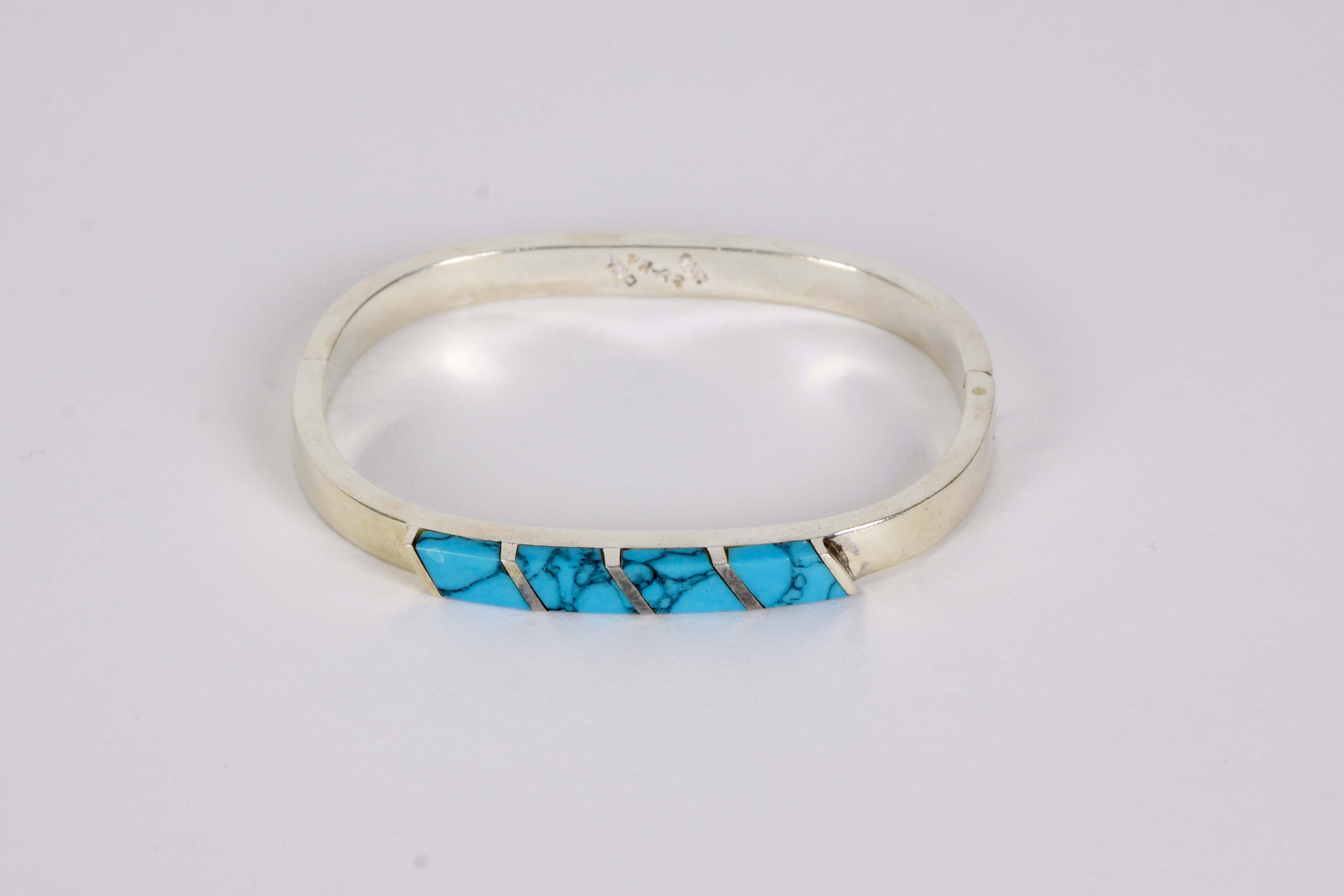 Silver Bracelet, Earrings, and Pendants