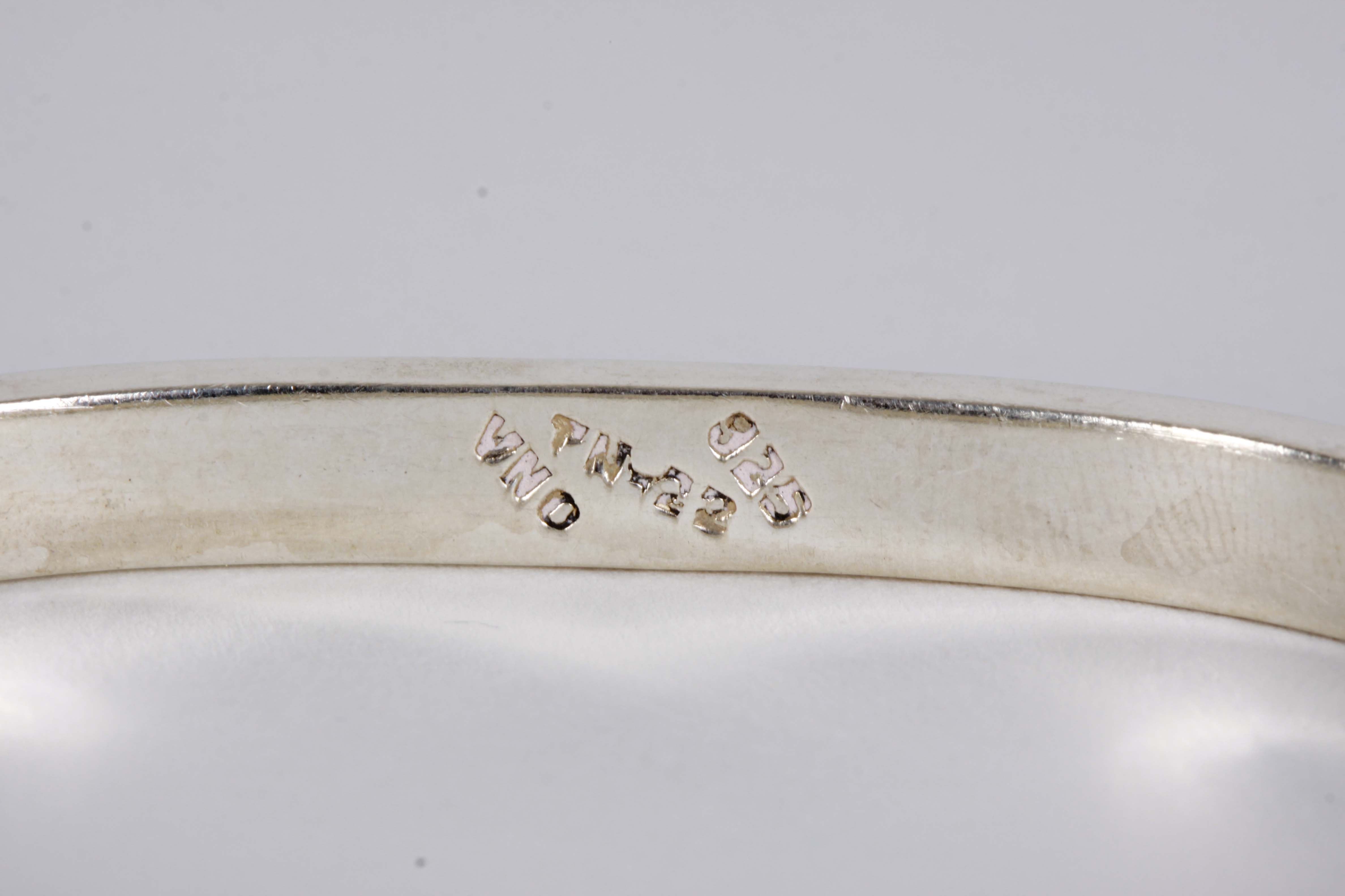 Silver Bracelet, Earrings, and Pendants