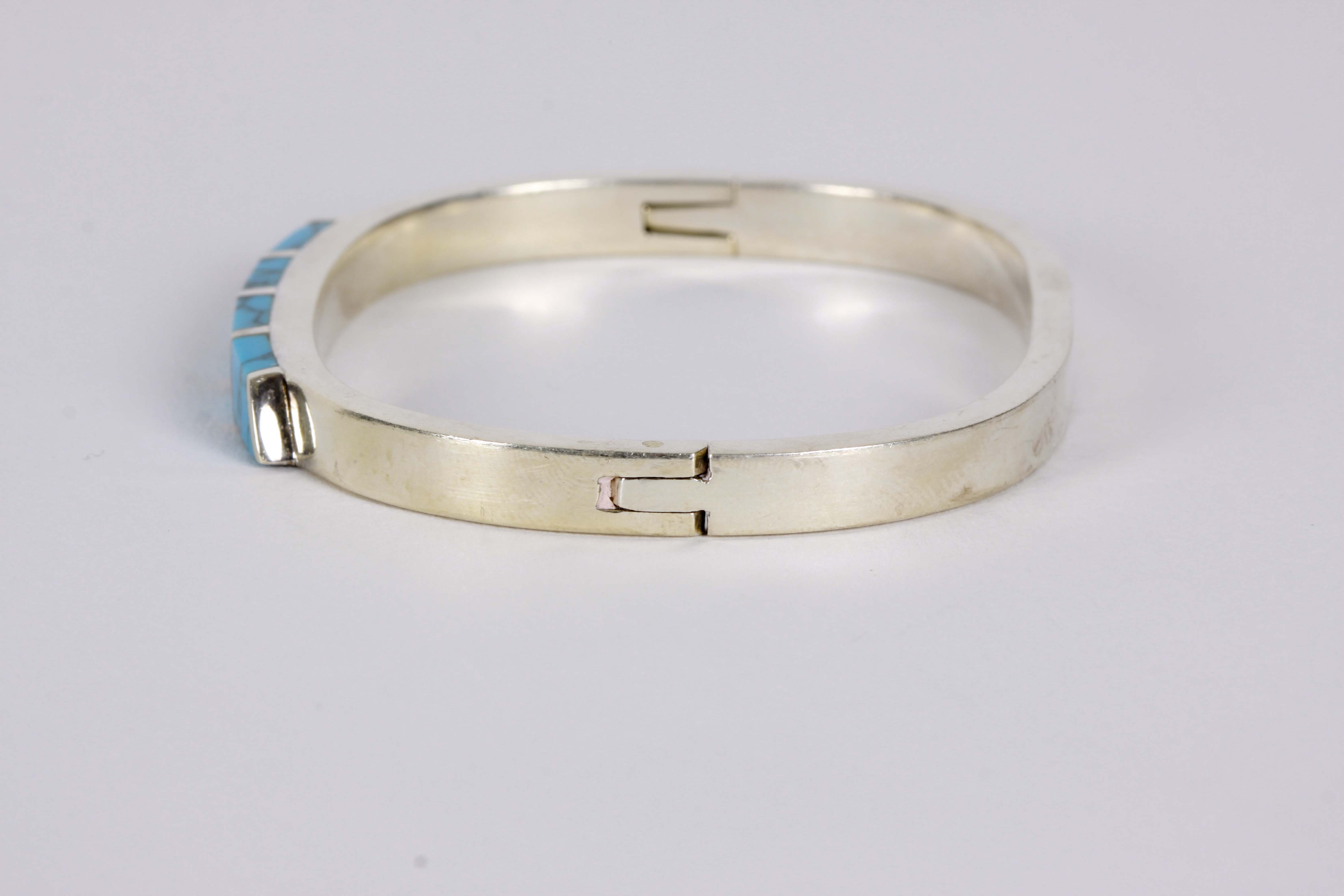 Silver Bracelet, Earrings, and Pendants