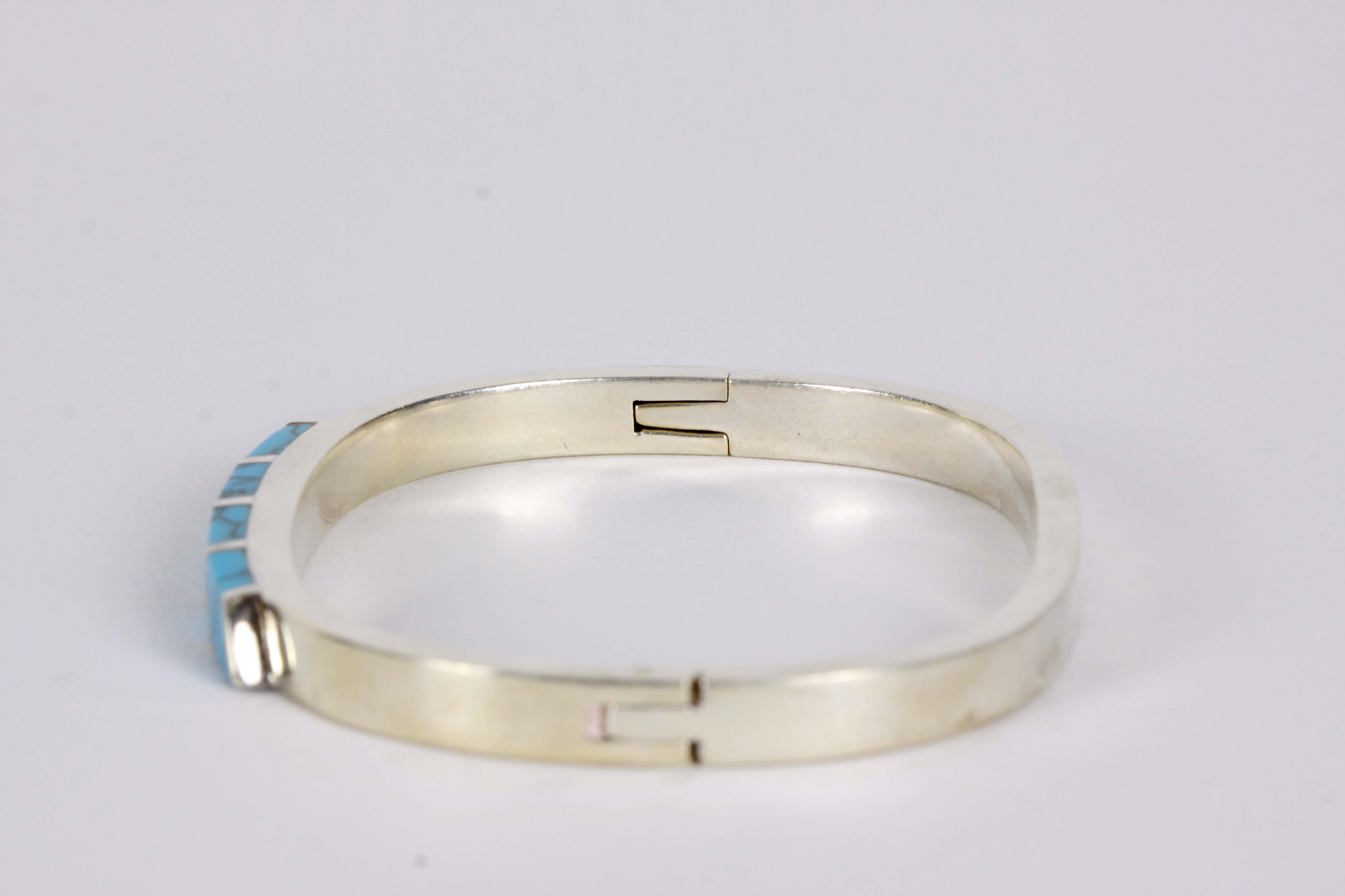 Silver Bracelet, Earrings, and Pendants