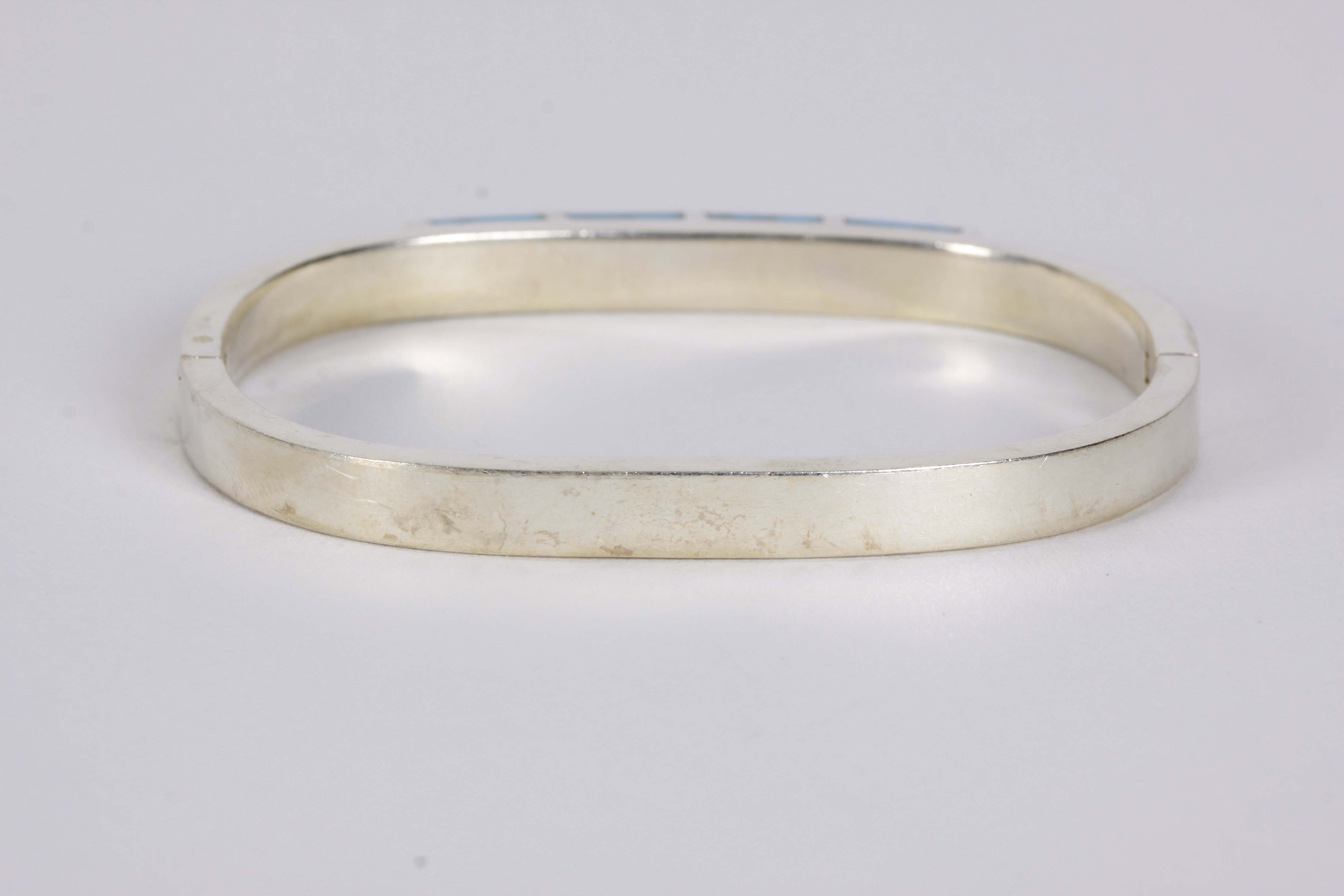 Silver Bracelet, Earrings, and Pendants