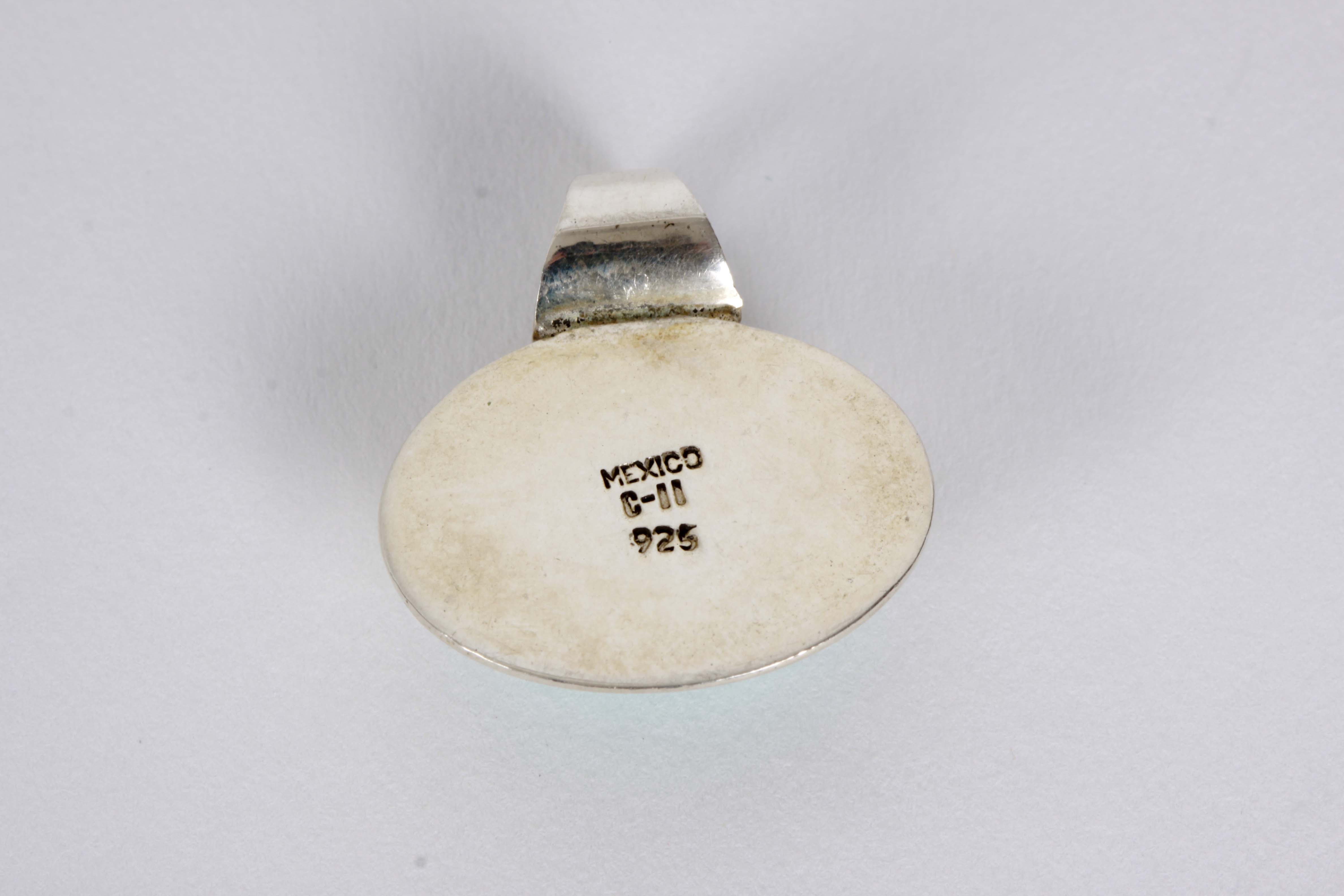 Silver Bracelet, Earrings, and Pendants