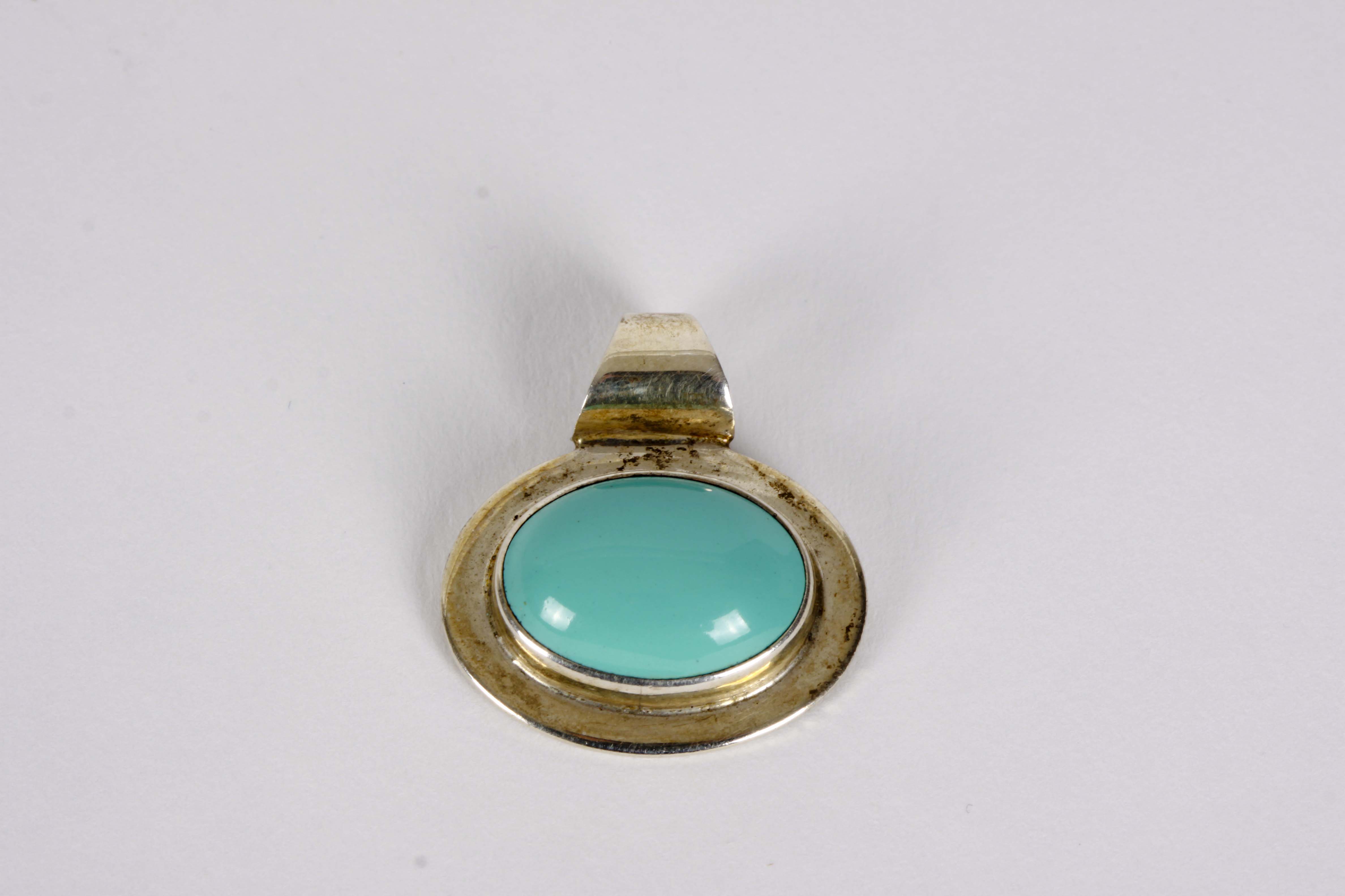 Silver Bracelet, Earrings, and Pendants