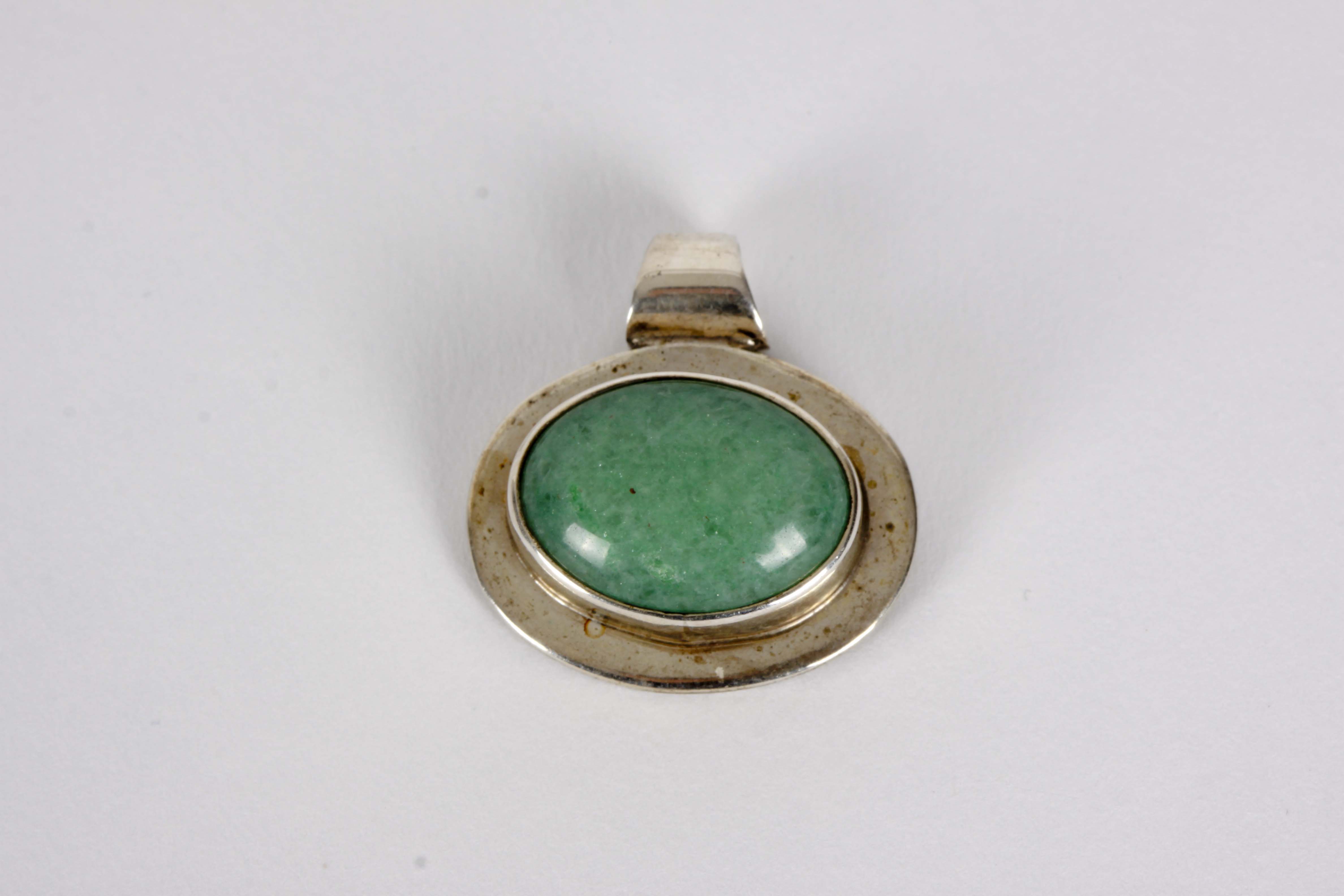 Silver Bracelet, Earrings, and Pendants