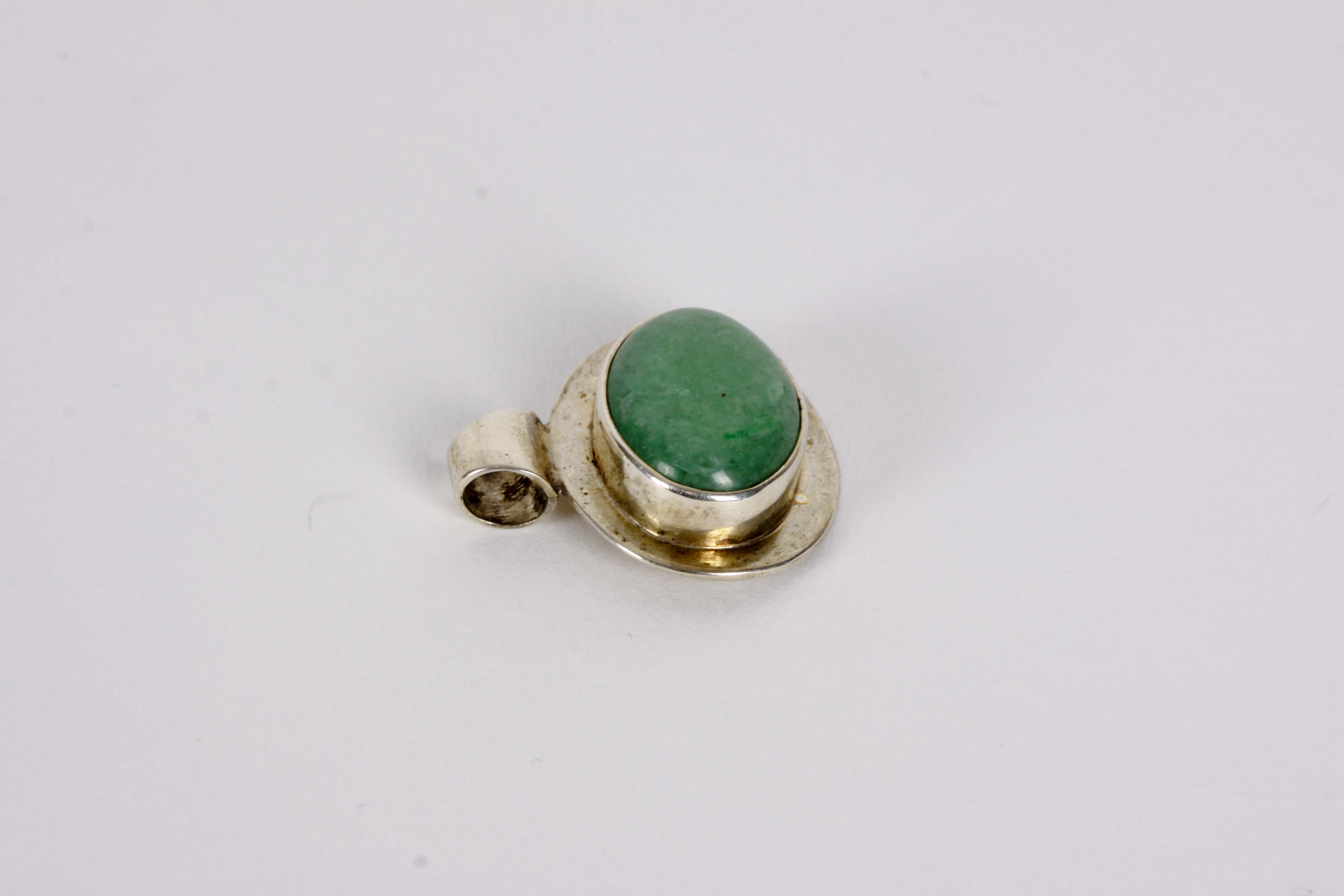 Silver Bracelet, Earrings, and Pendants