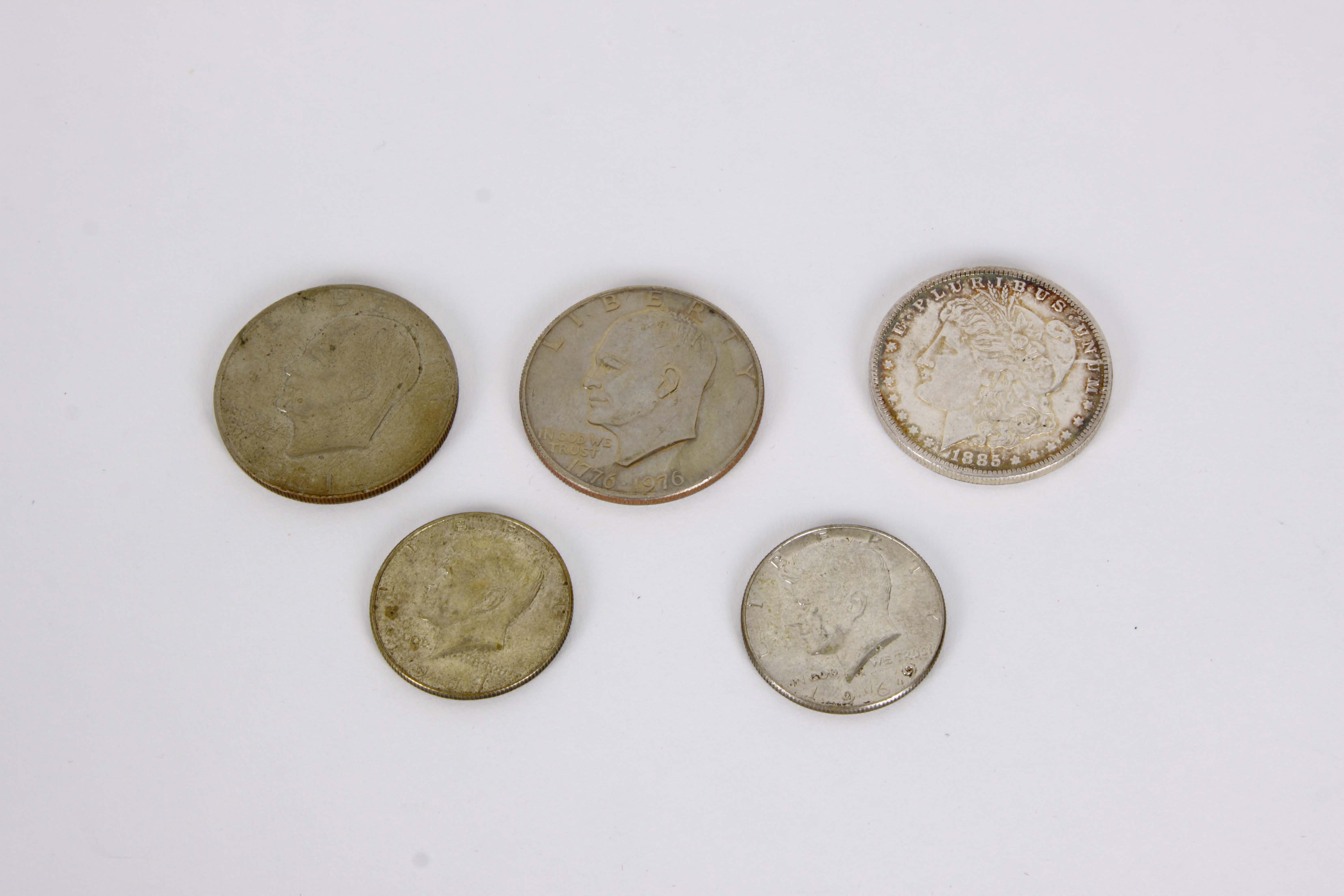 A Group of United States Silver Dollars and Half Dollars