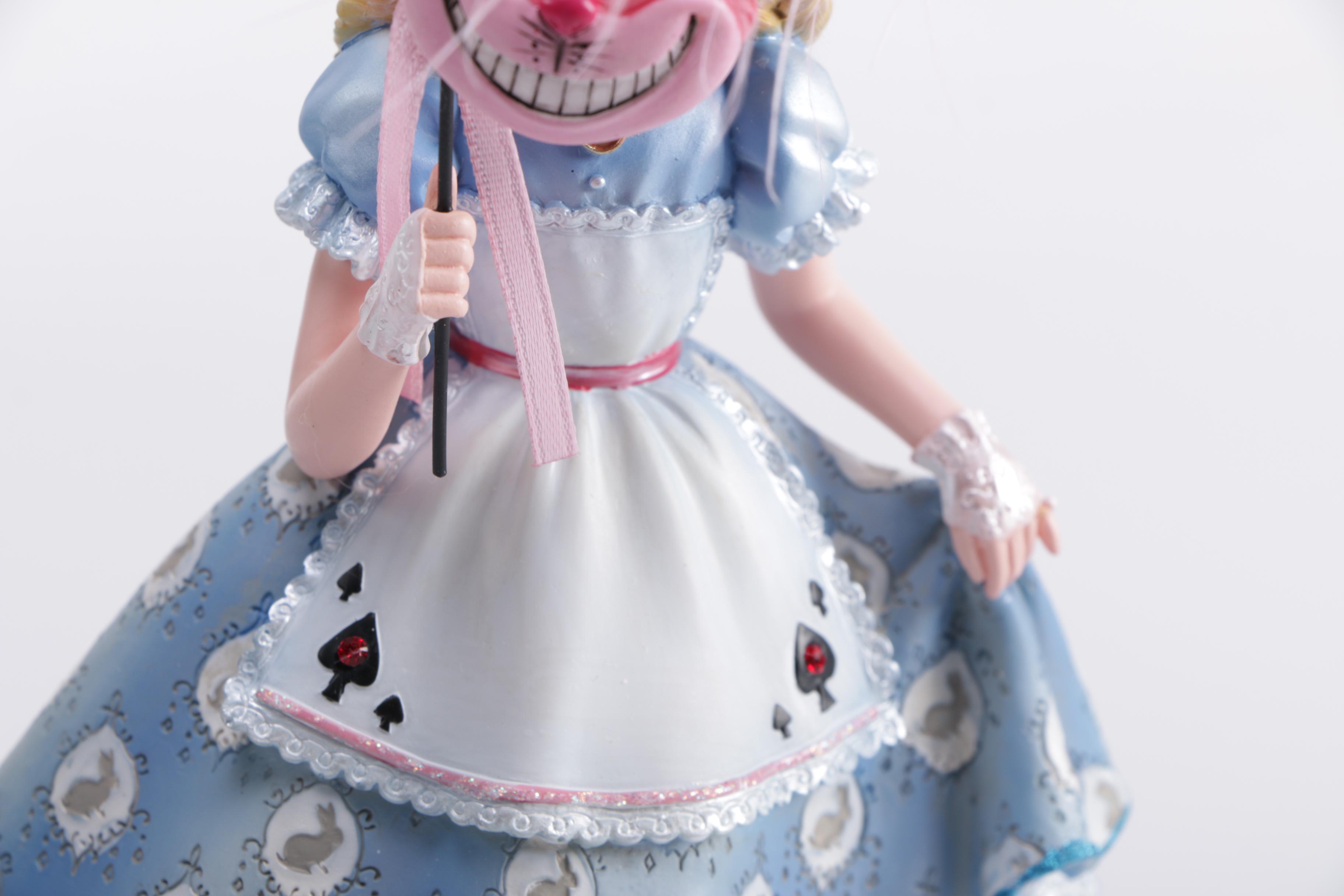 Disney Figurines Including Masquerade Snow White, Belle, and Alice