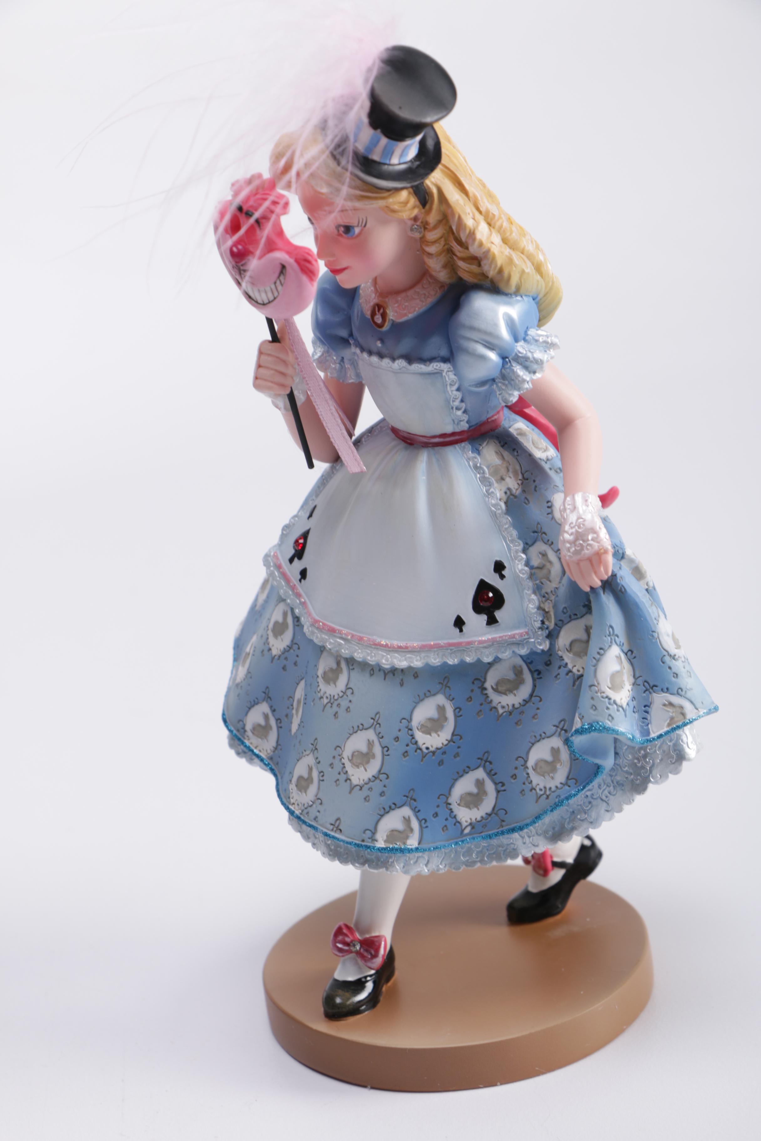 Disney Figurines Including Masquerade Snow White, Belle, and Alice