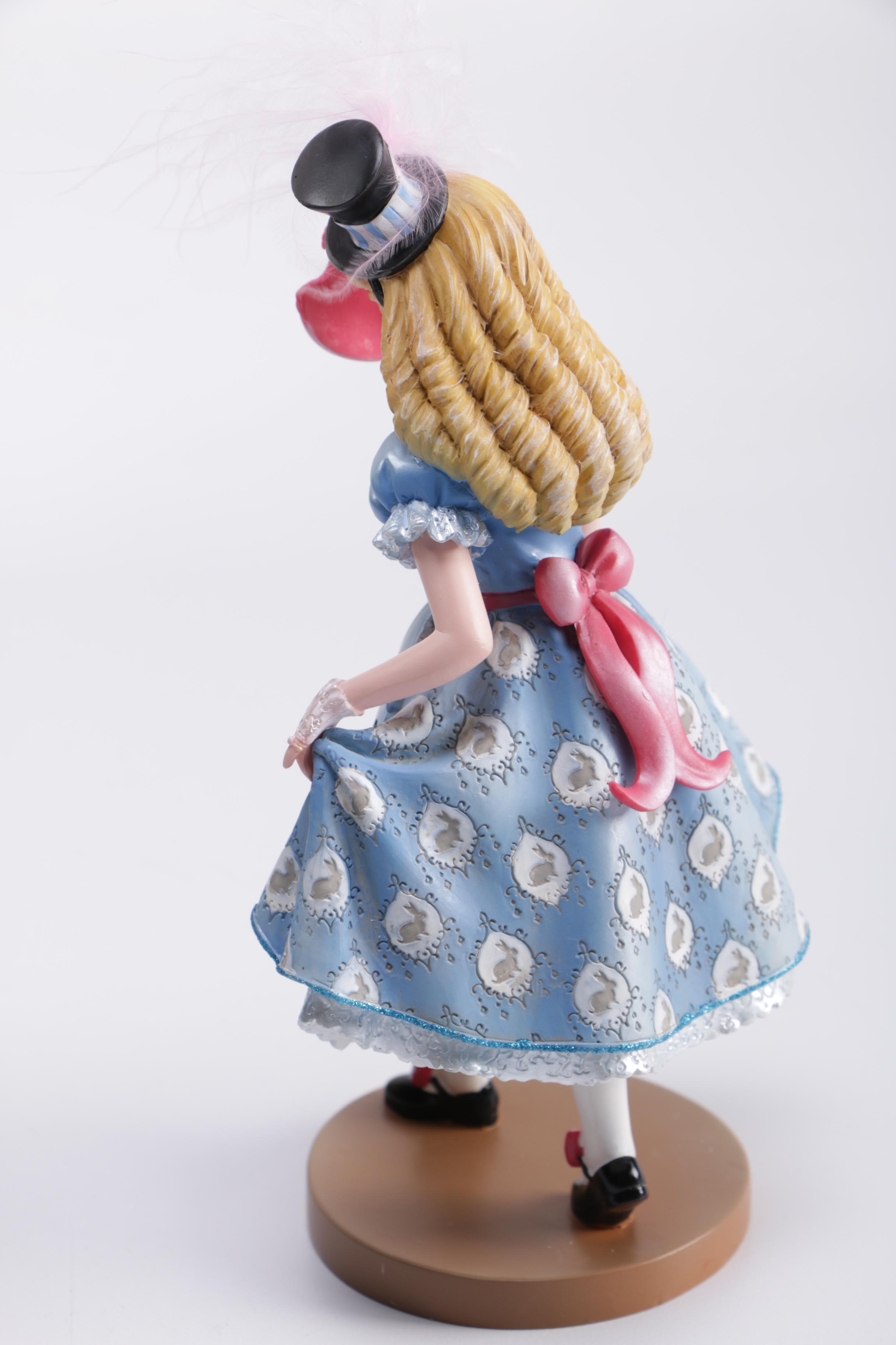 Disney Figurines Including Masquerade Snow White, Belle, and Alice