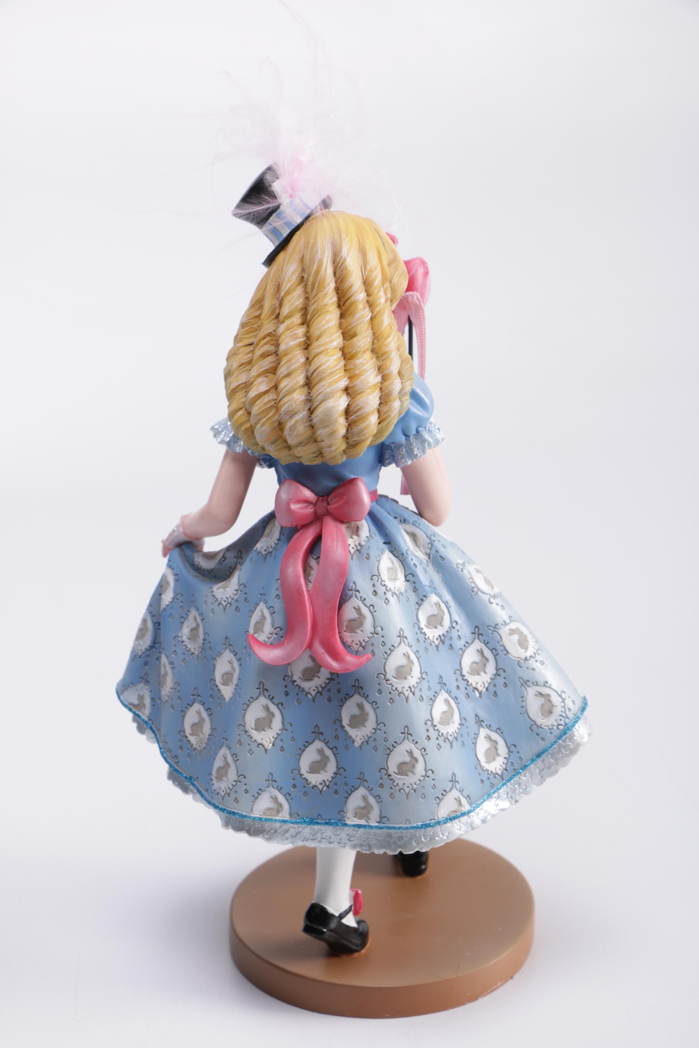 Disney Figurines Including Masquerade Snow White, Belle, and Alice