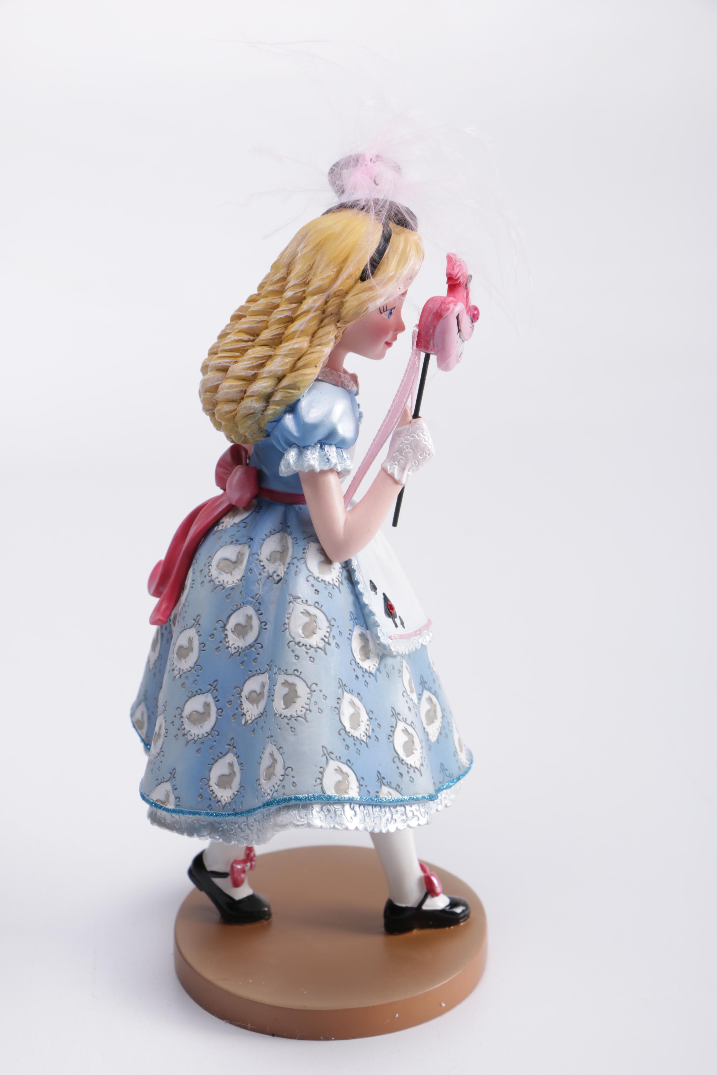 Disney Figurines Including Masquerade Snow White, Belle, and Alice
