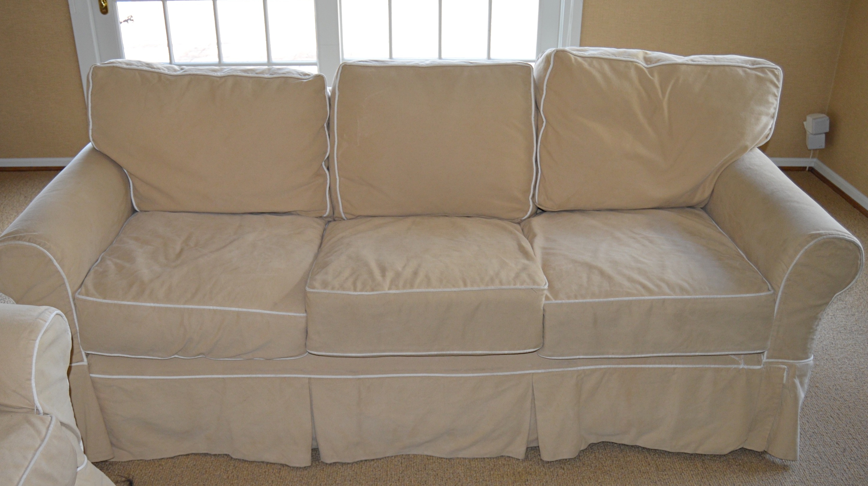 Four Seasons Tan Slipcovered Sofa