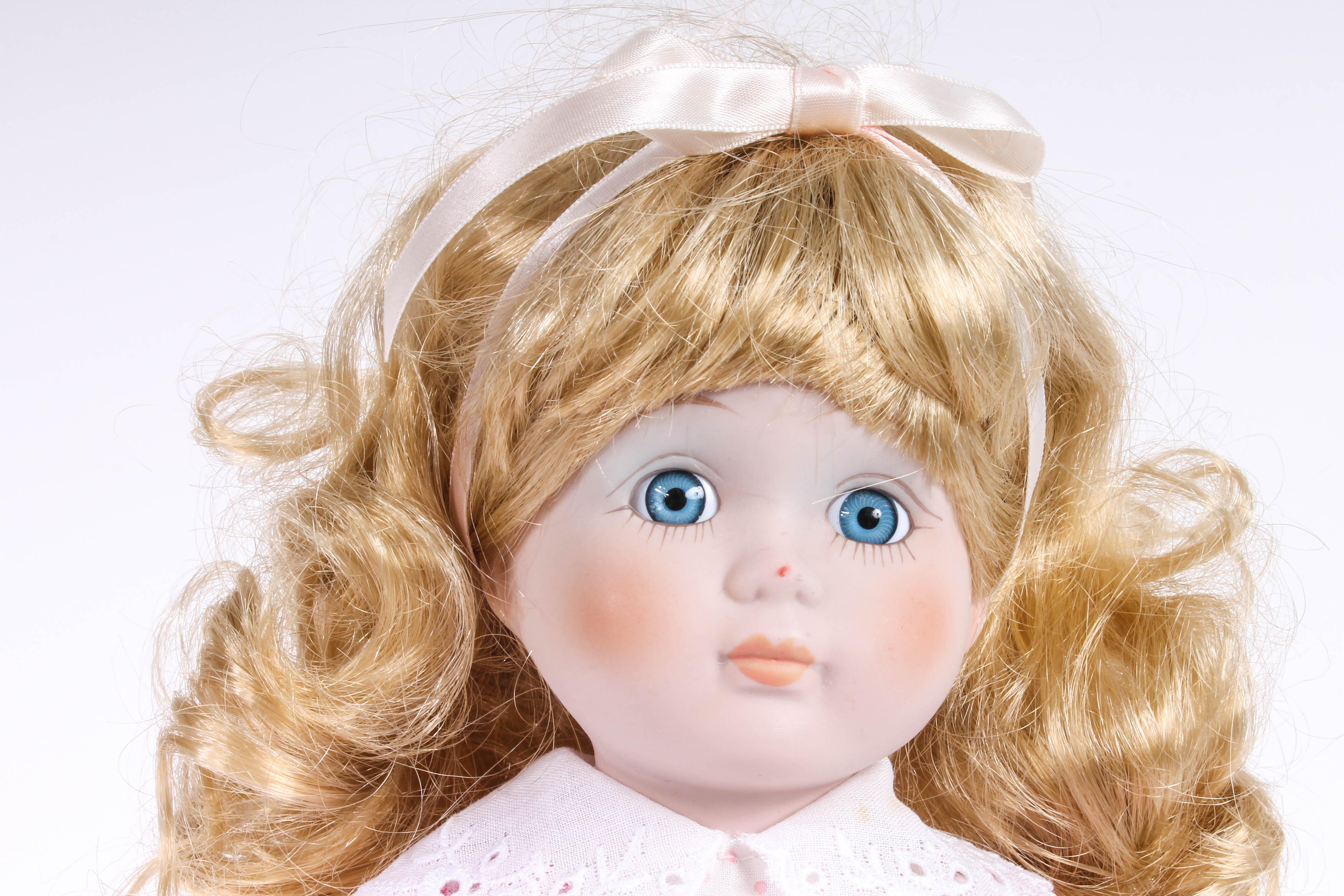 Four Porcelain Dolls by Dynasty Doll