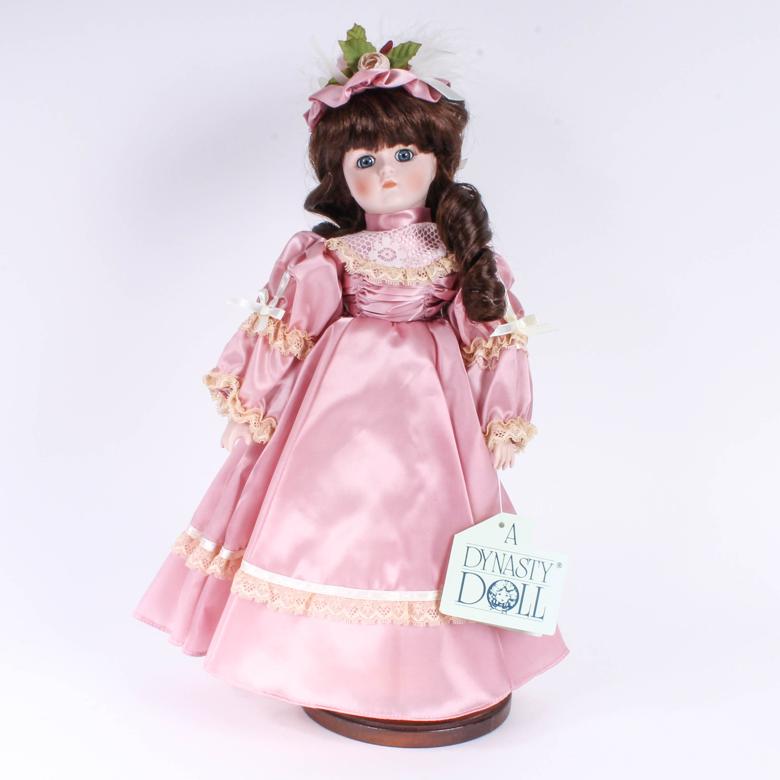Four Porcelain Dolls by Dynasty Doll