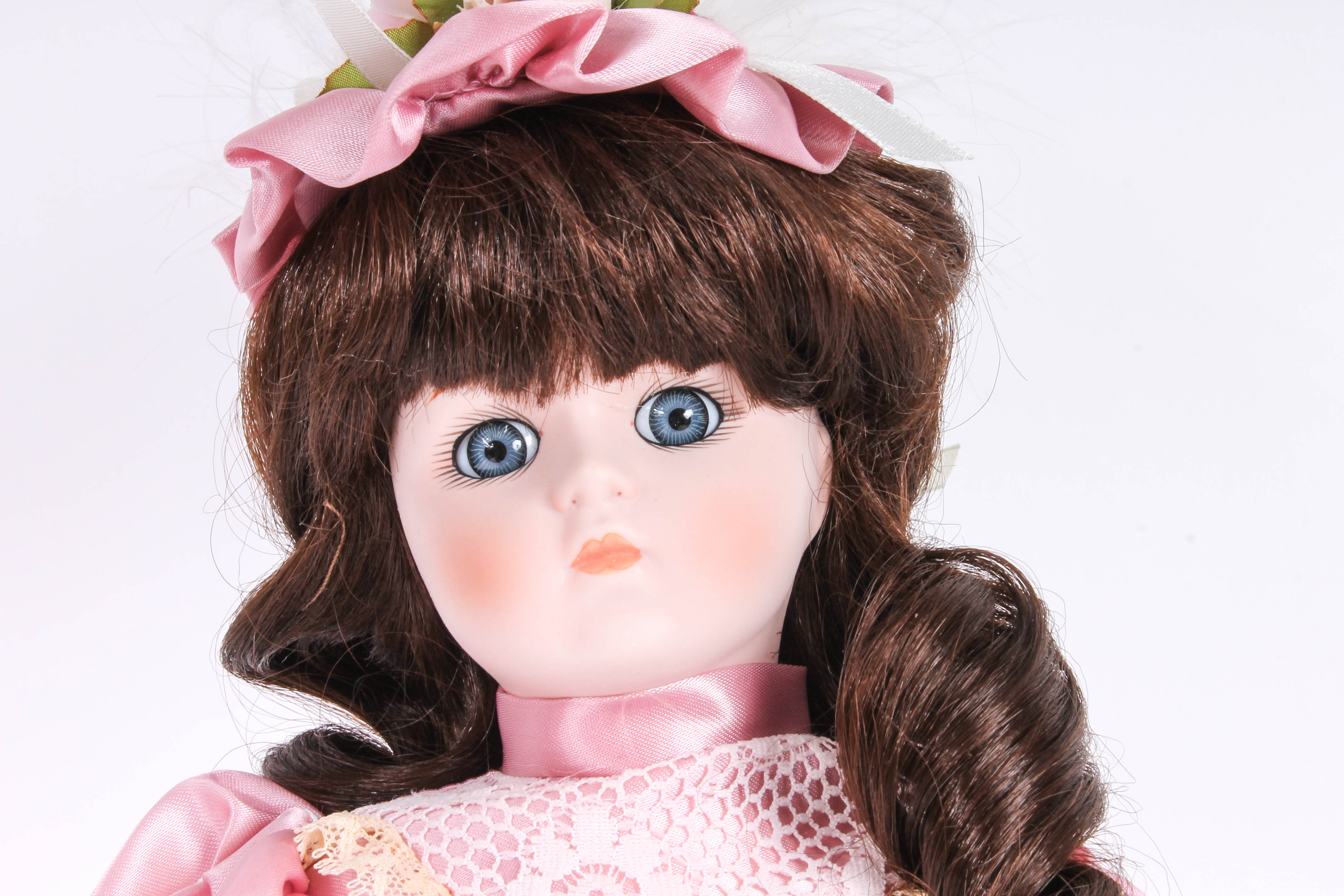 Four Porcelain Dolls by Dynasty Doll