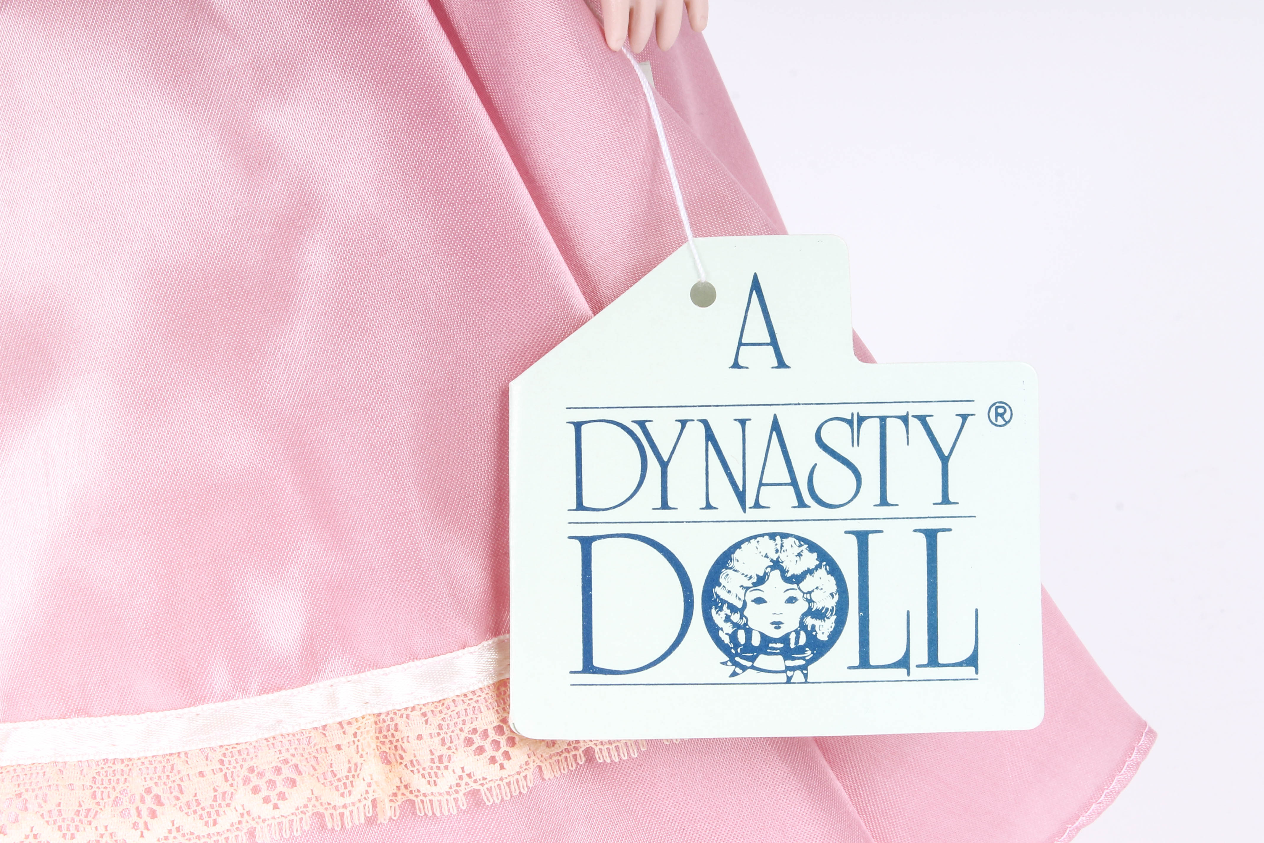 Four Porcelain Dolls by Dynasty Doll