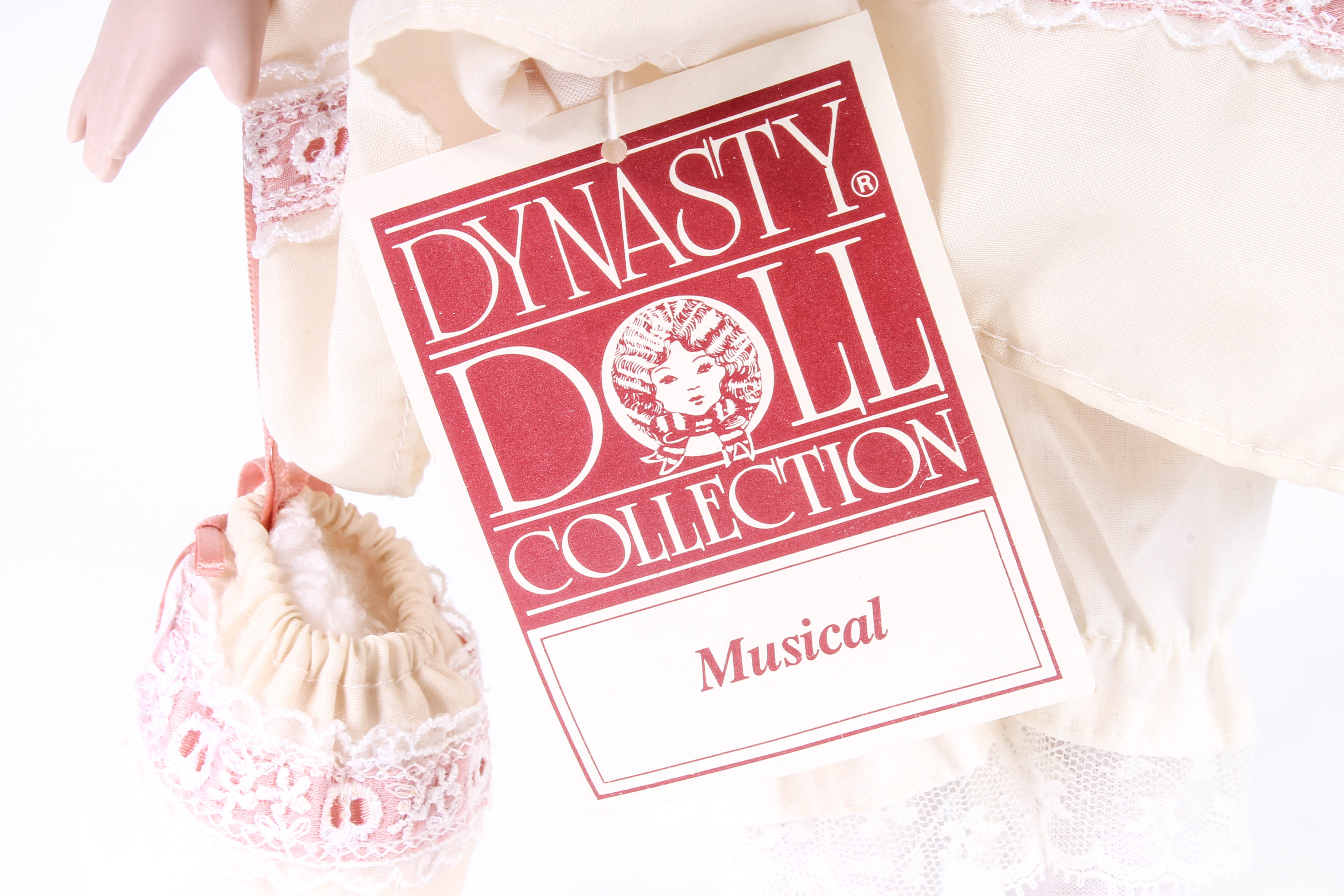 Four Porcelain Dolls by Dynasty Doll